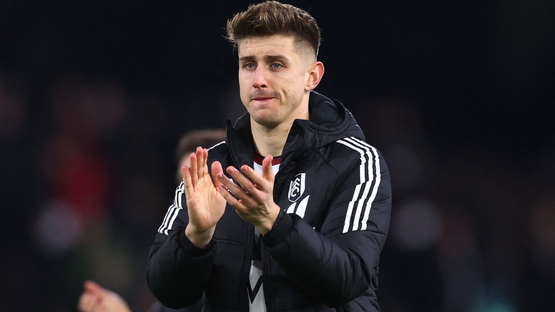 Tom Cairney of Fulham applauds the fans