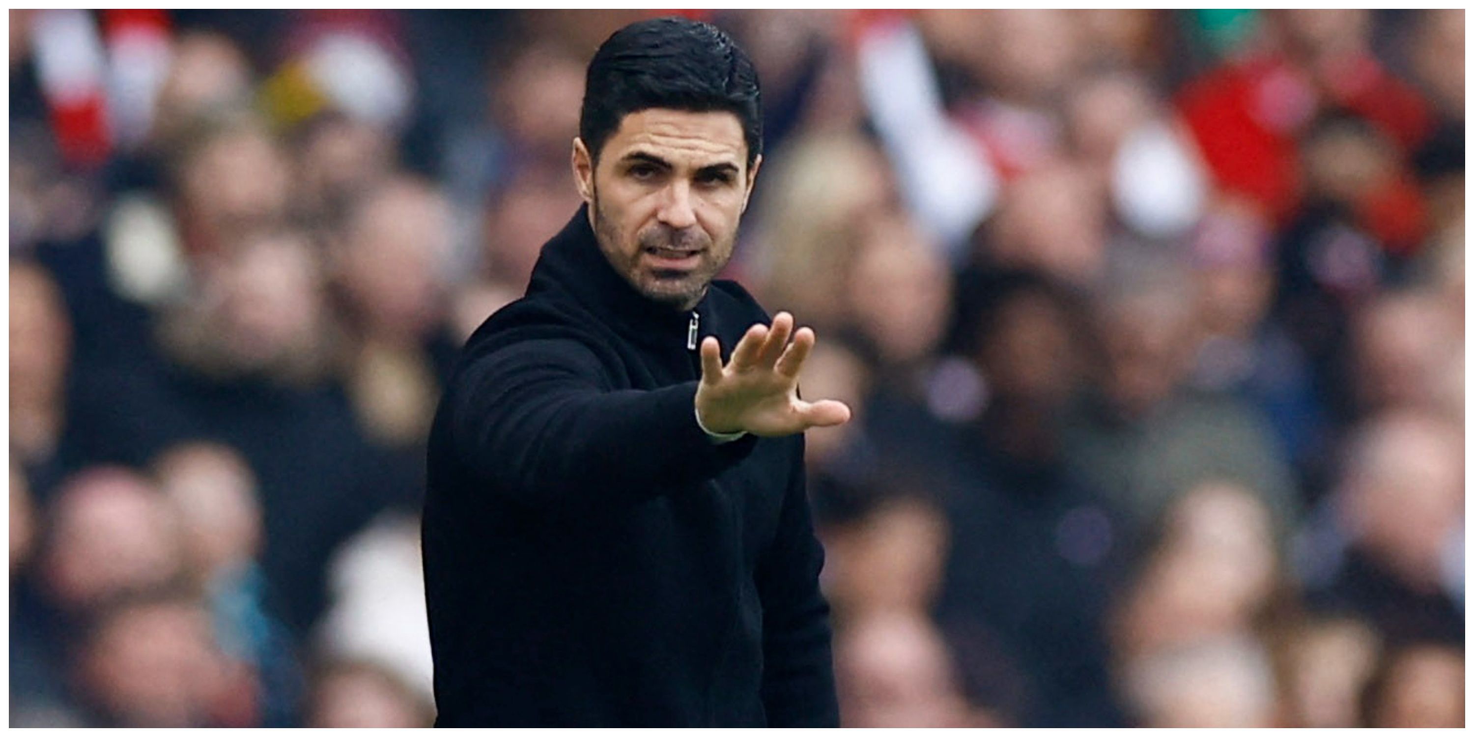 Arsenal manager Mikel Arteta with outstretched arm