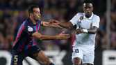 Sergio Busquets and Vinicius Jr during Barcelona vs Real Madrid.