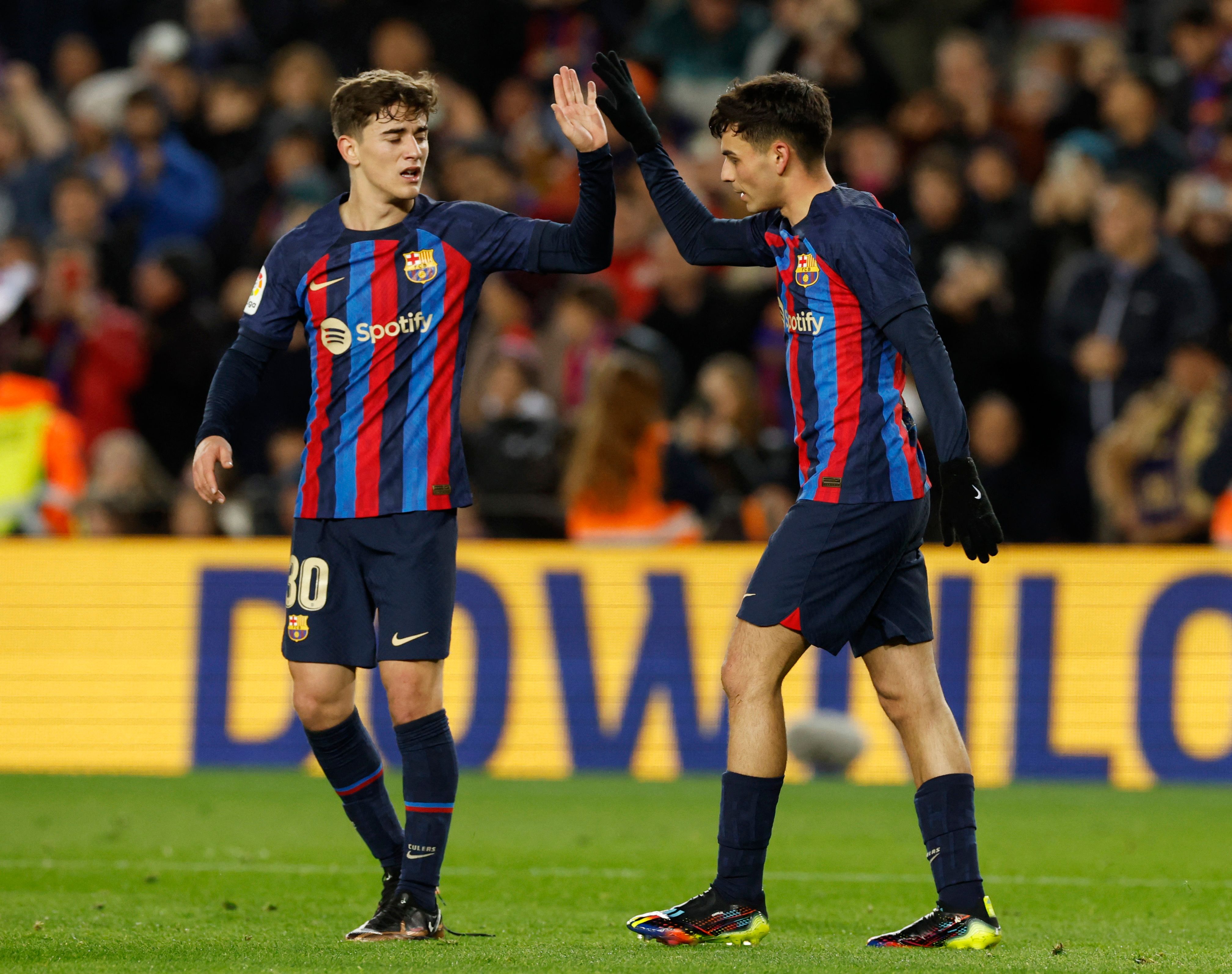 FC Barcelona's Pedri celebrates scoring their first goal with Gavi.