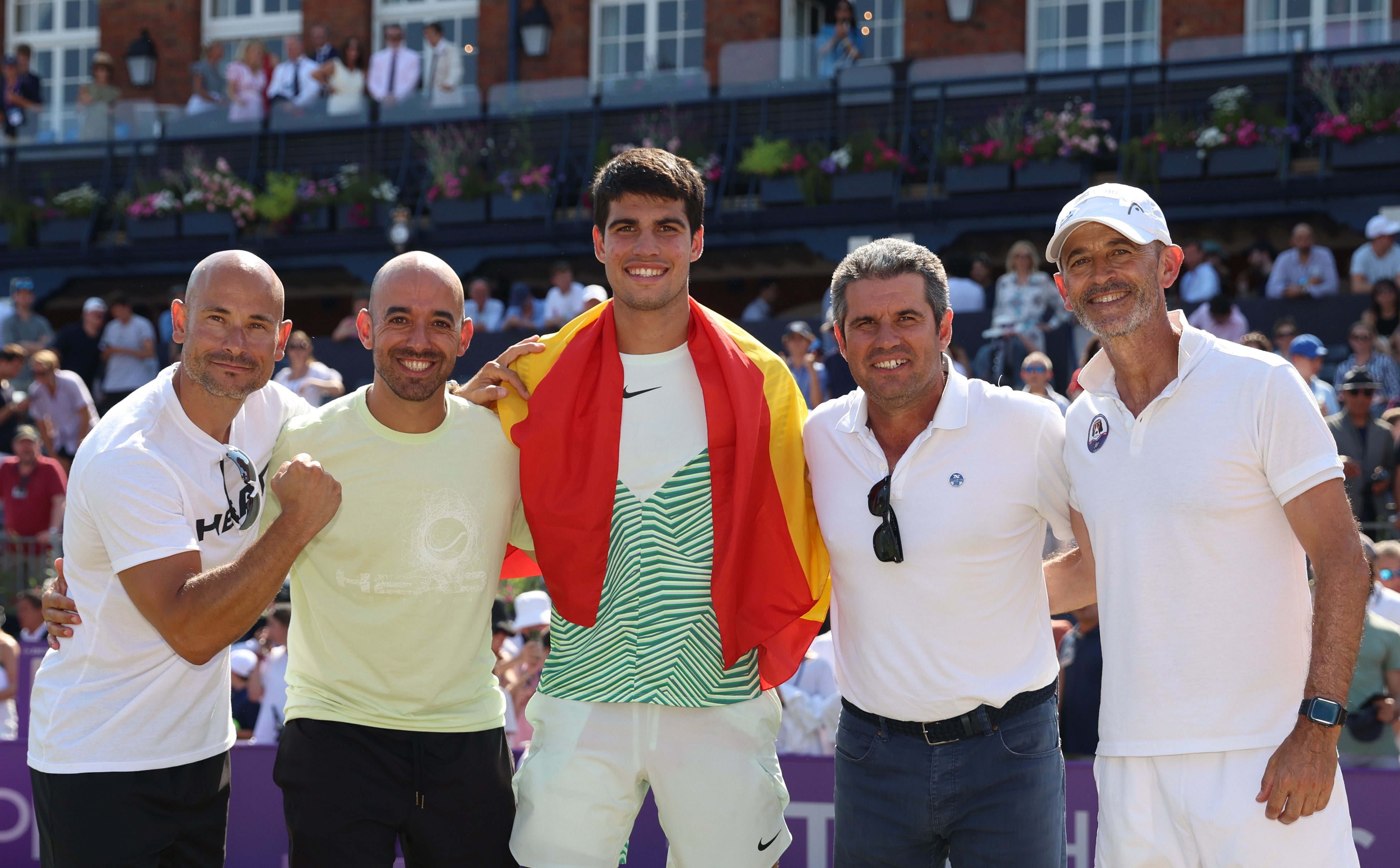 Carlos Alcaraz celebrates winning the Queen's Club championship with his coaching team