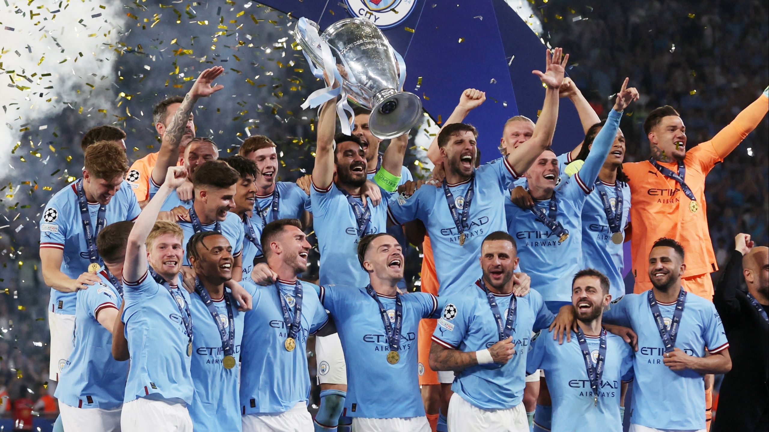 Man City players lift the 2023 Champions League trophy