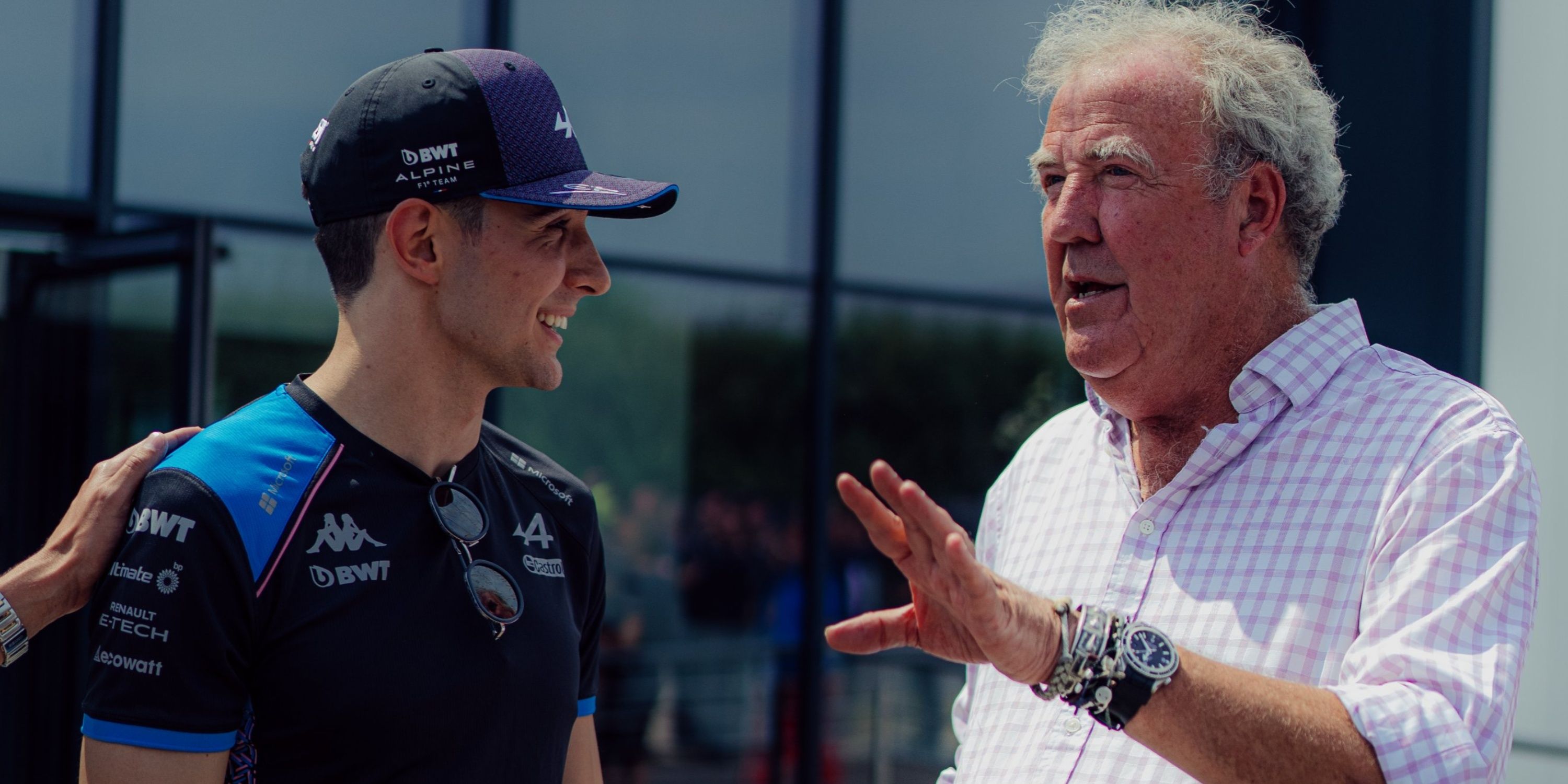 Esteban Ocon and Jeremy Clarkson chat at the Alpine factory