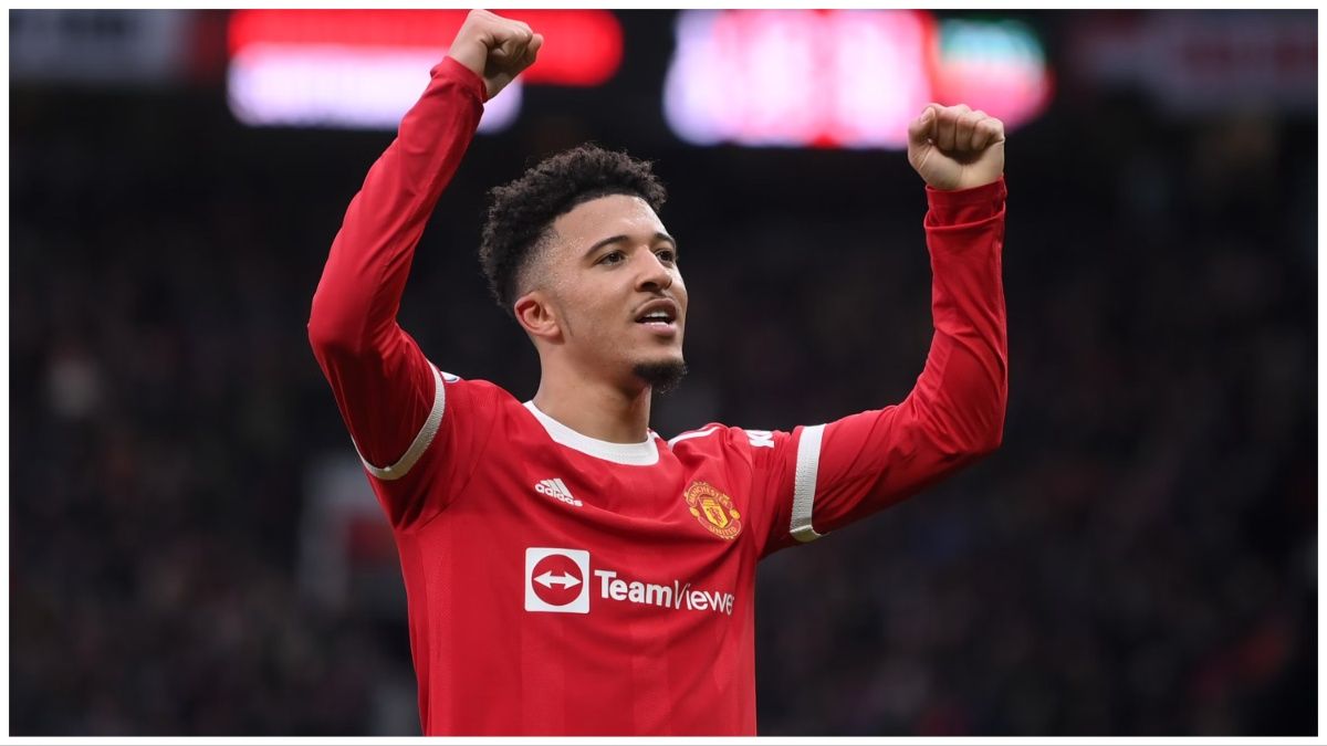 Jadon Sancho places his arms in the air in celebration to the Old Trafford crowd in a Premier League game against Southampton.