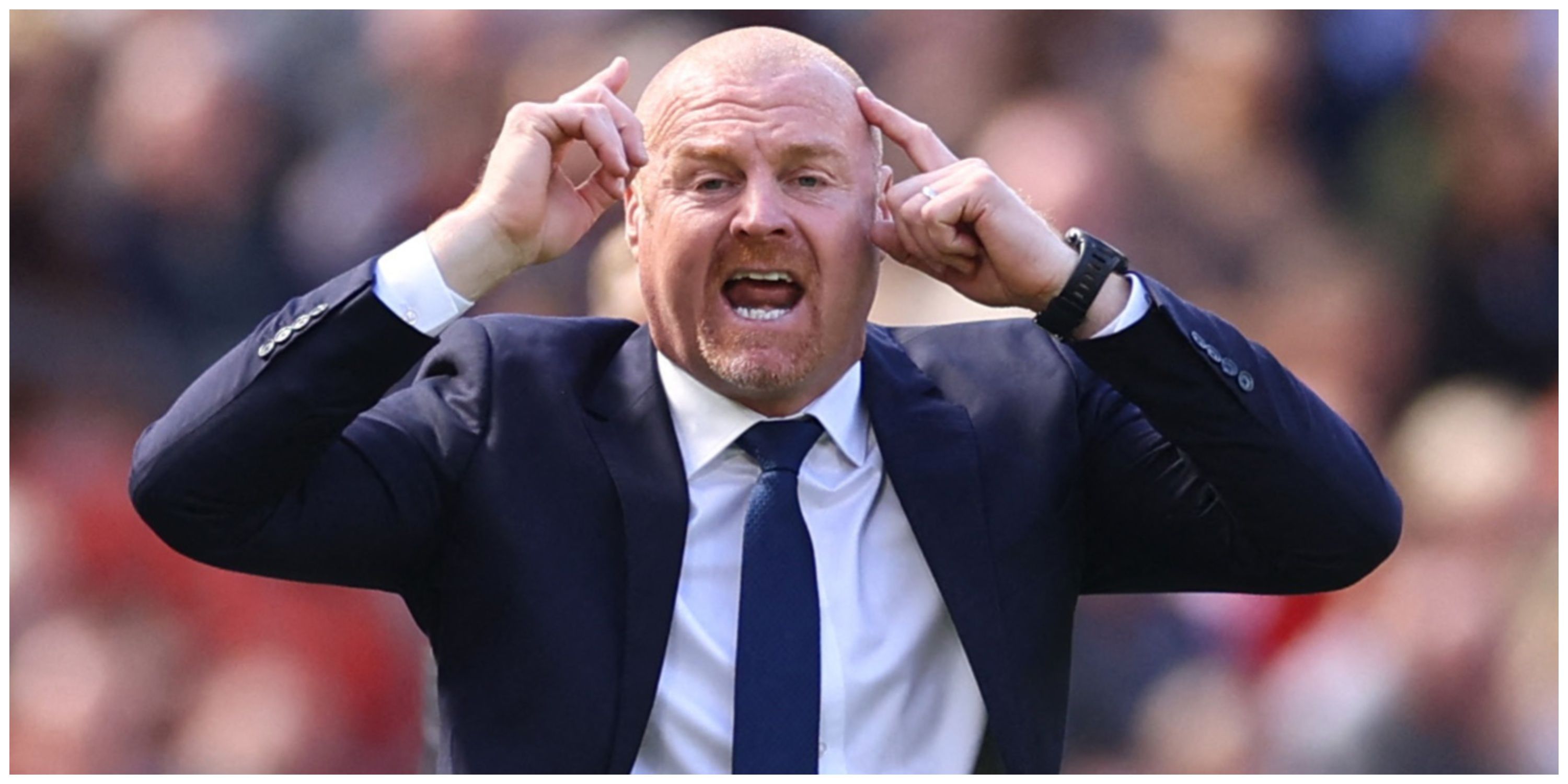 Everton manager Sean Dyche pointing at his head
