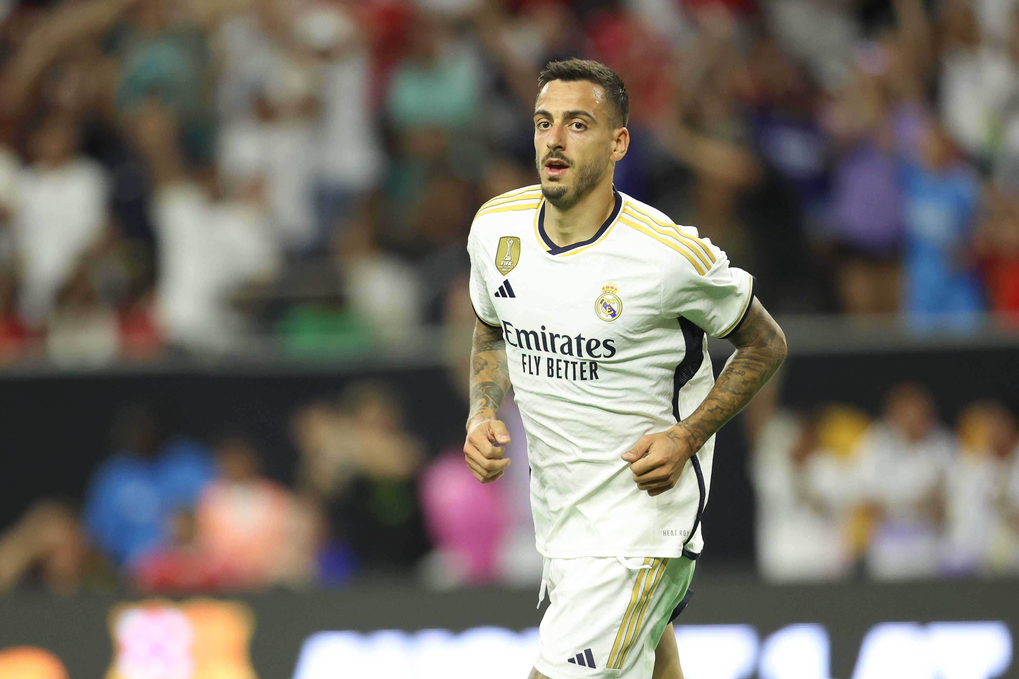 Joselu #14 of Real Madrid celebrates after scoring the second goal of his team during a friendly match between Real Madrid and Manchester United.
