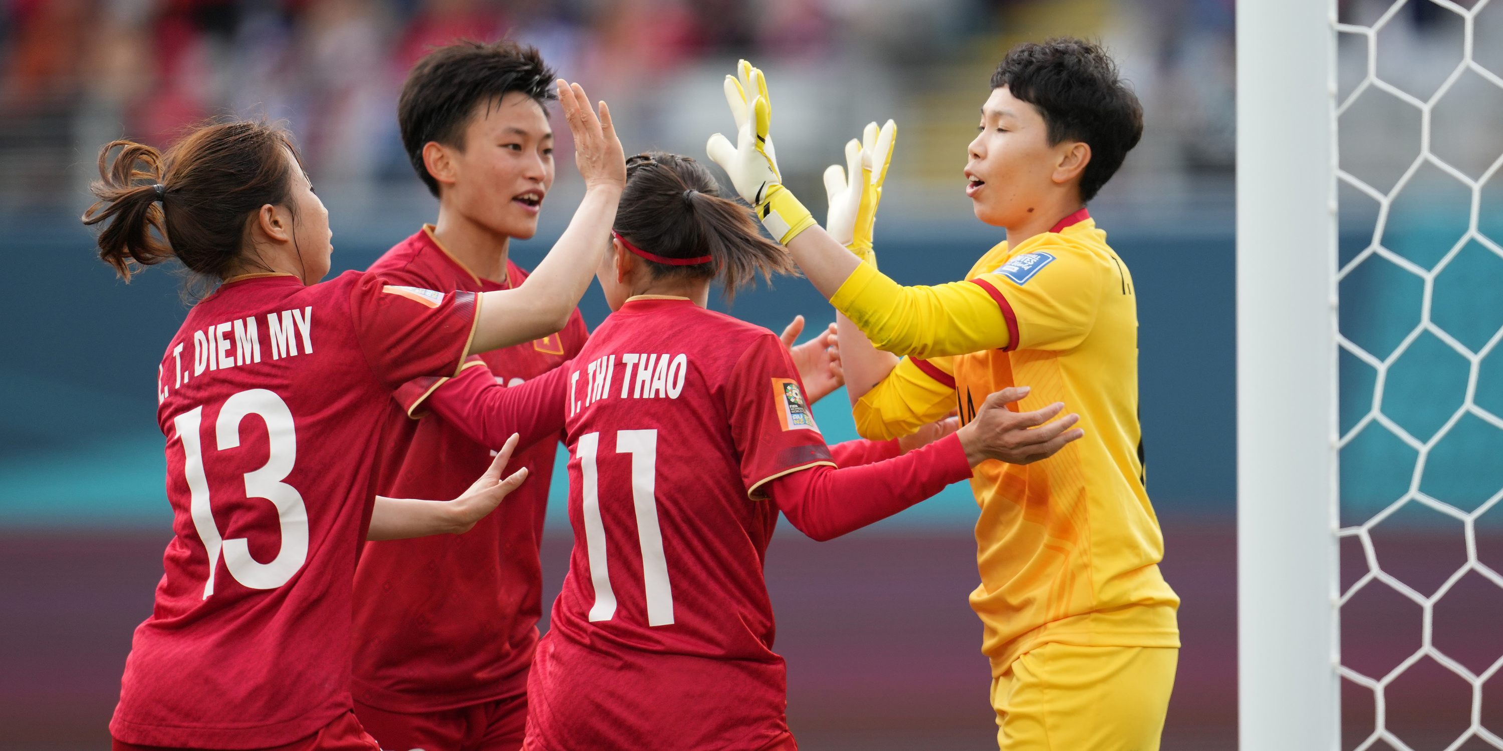 Vietnam's Trần Thị Kim Thanh celebrates penalty save with her teammates