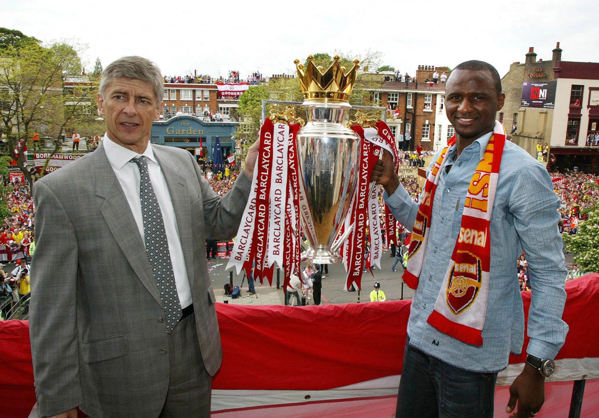Arsenal's manager Arsene Wenger (L) of France and captain Patrick Vieira hold up the Barclaycard Premiership trophy