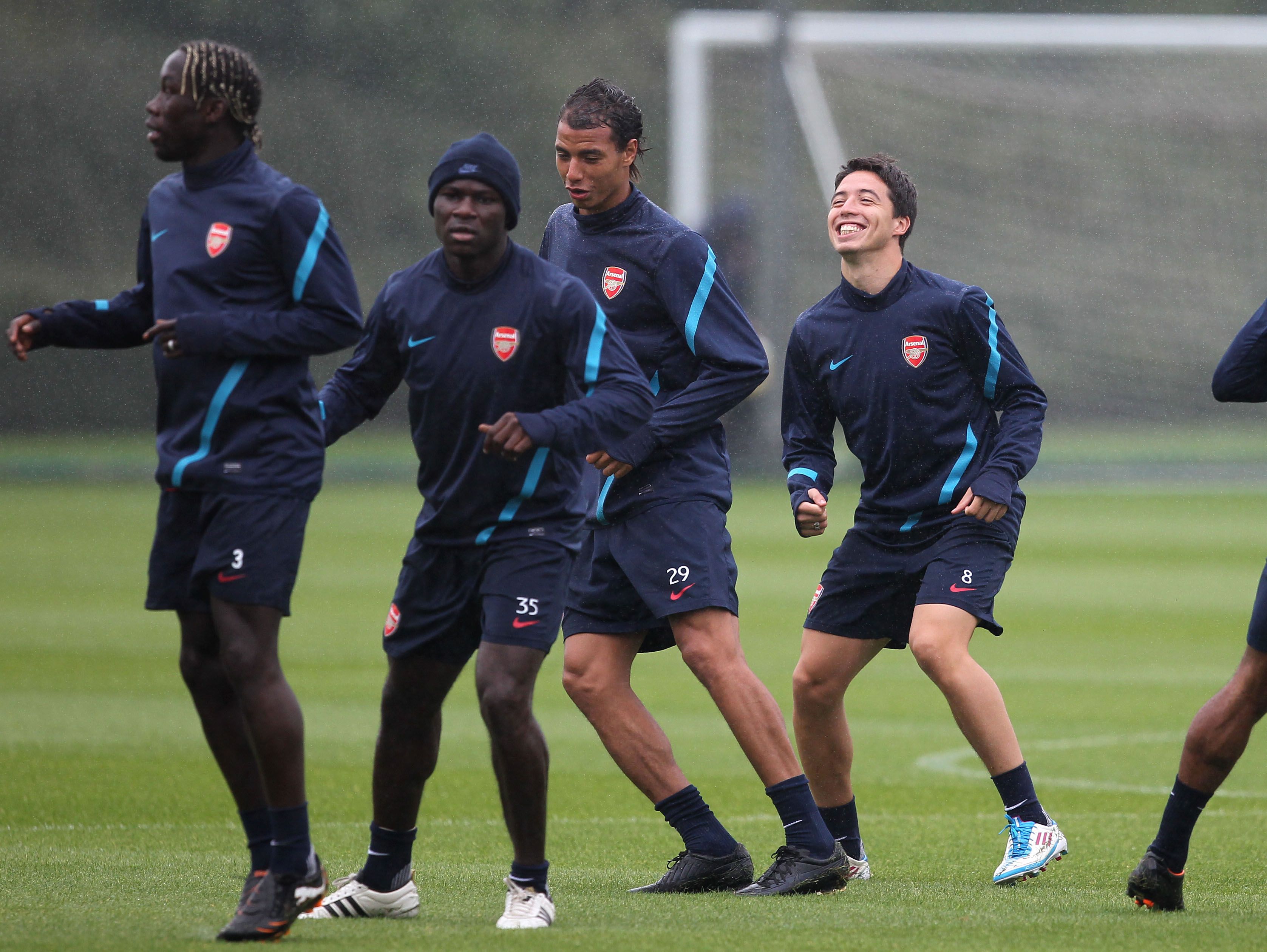 Emmanuel Frimpong (second from left) and Samir Nasri (right) in Arsenal training