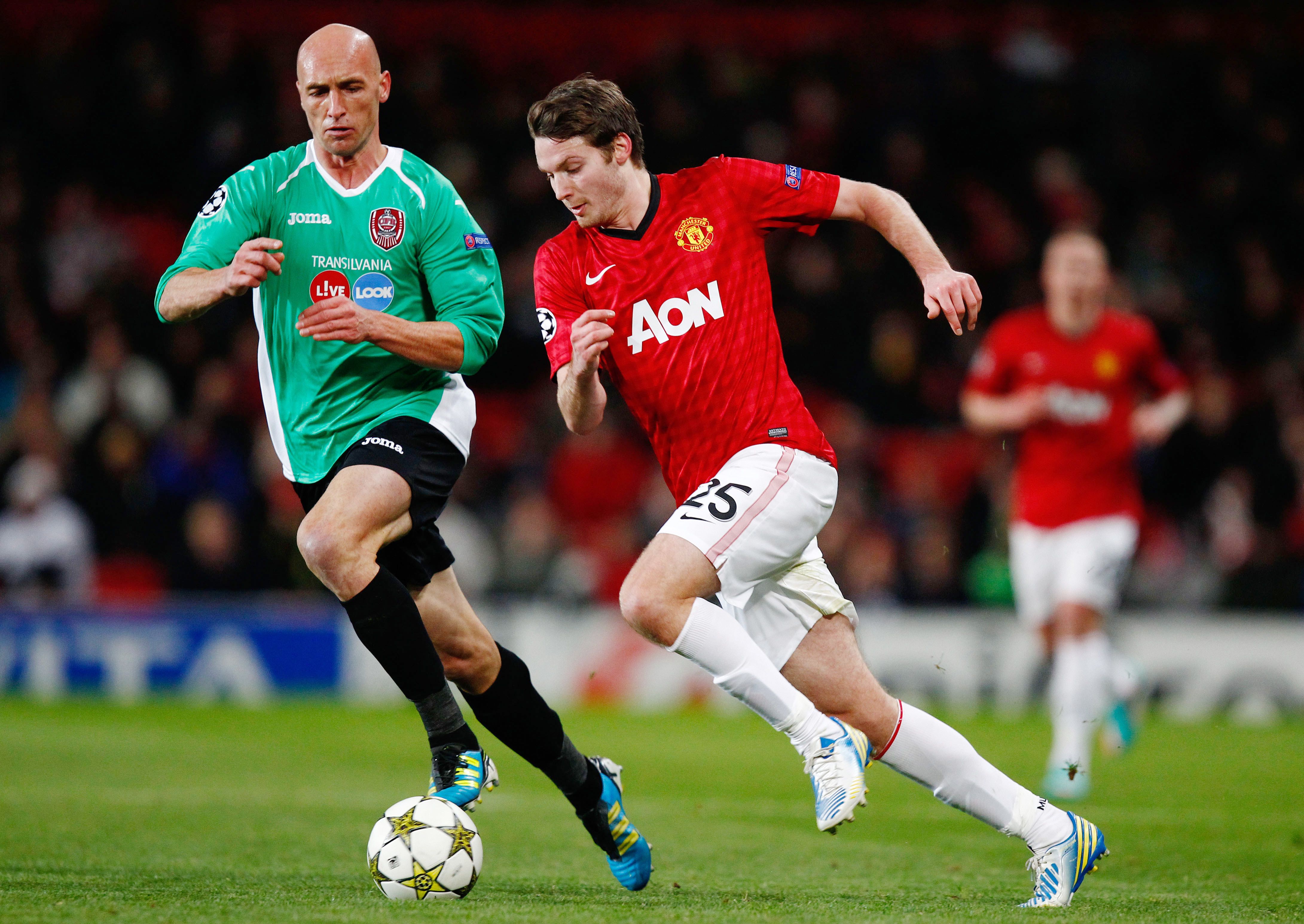 Manchester United's Nick Powell and CFR Cluj's Gabriel Muresan.