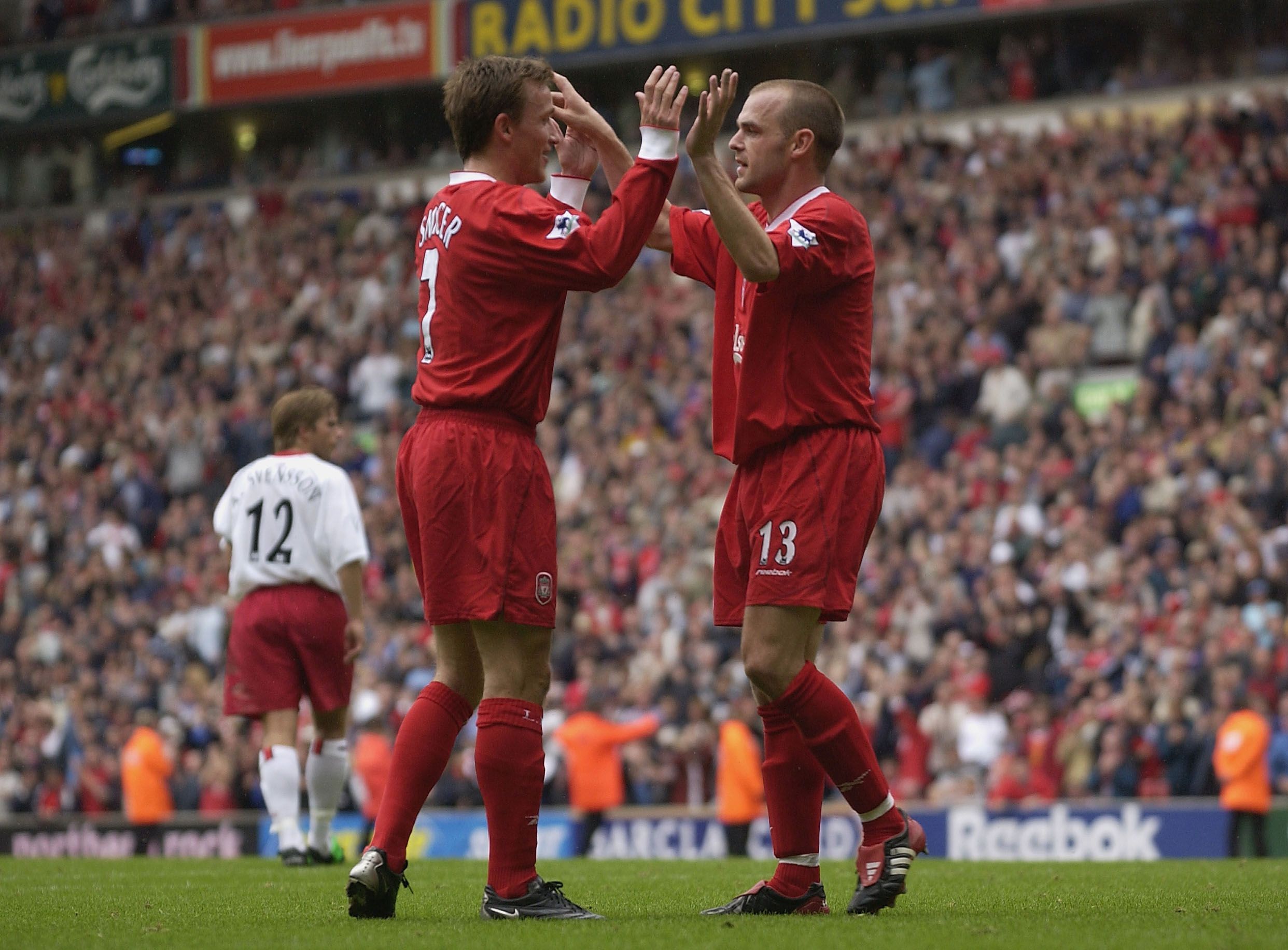Danny Murphy of Liverpool (right) celebrates with Vladimir Smicer.