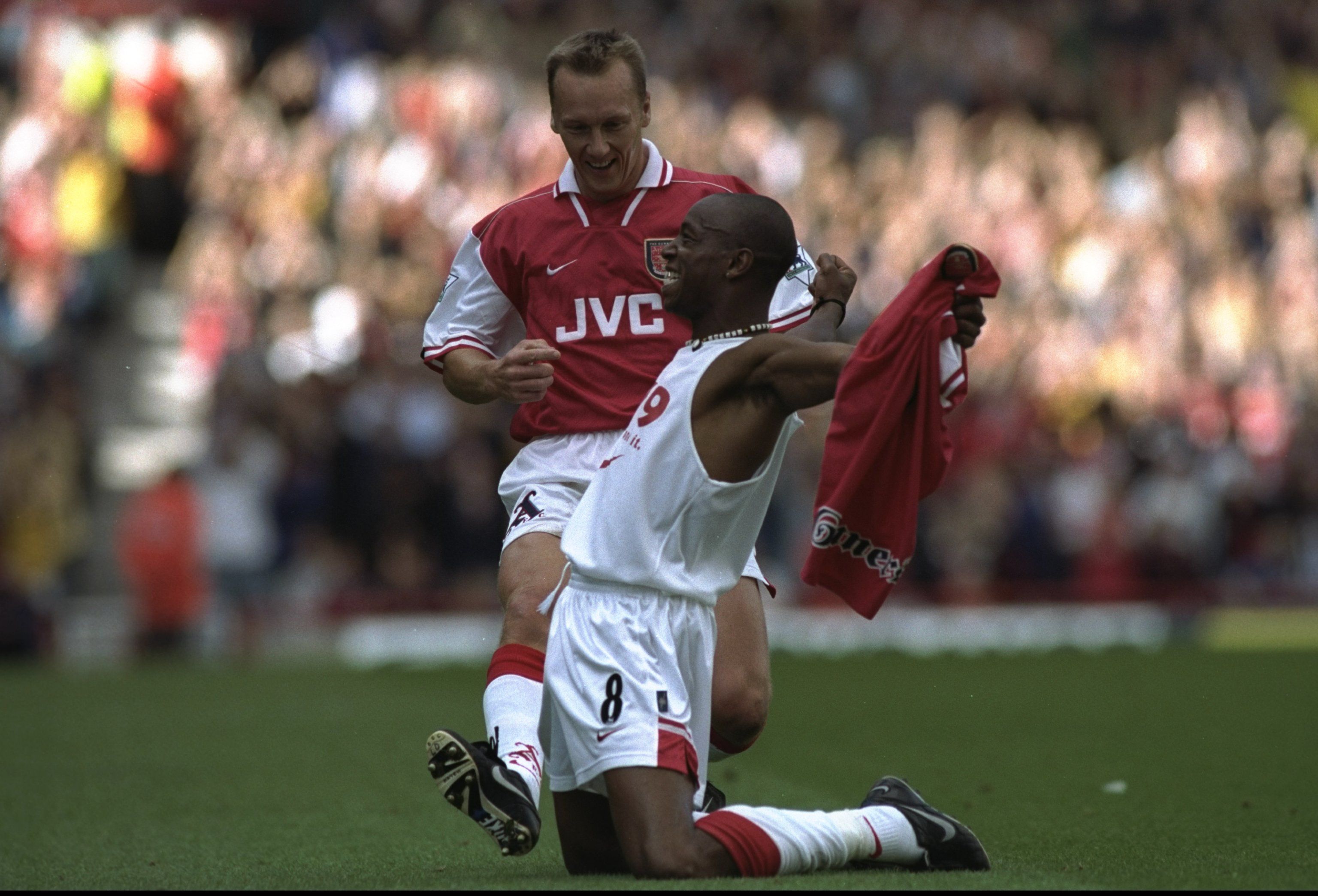 Ian Wright (front) and Lee Dixon (rear) of Arsenal celebrate
