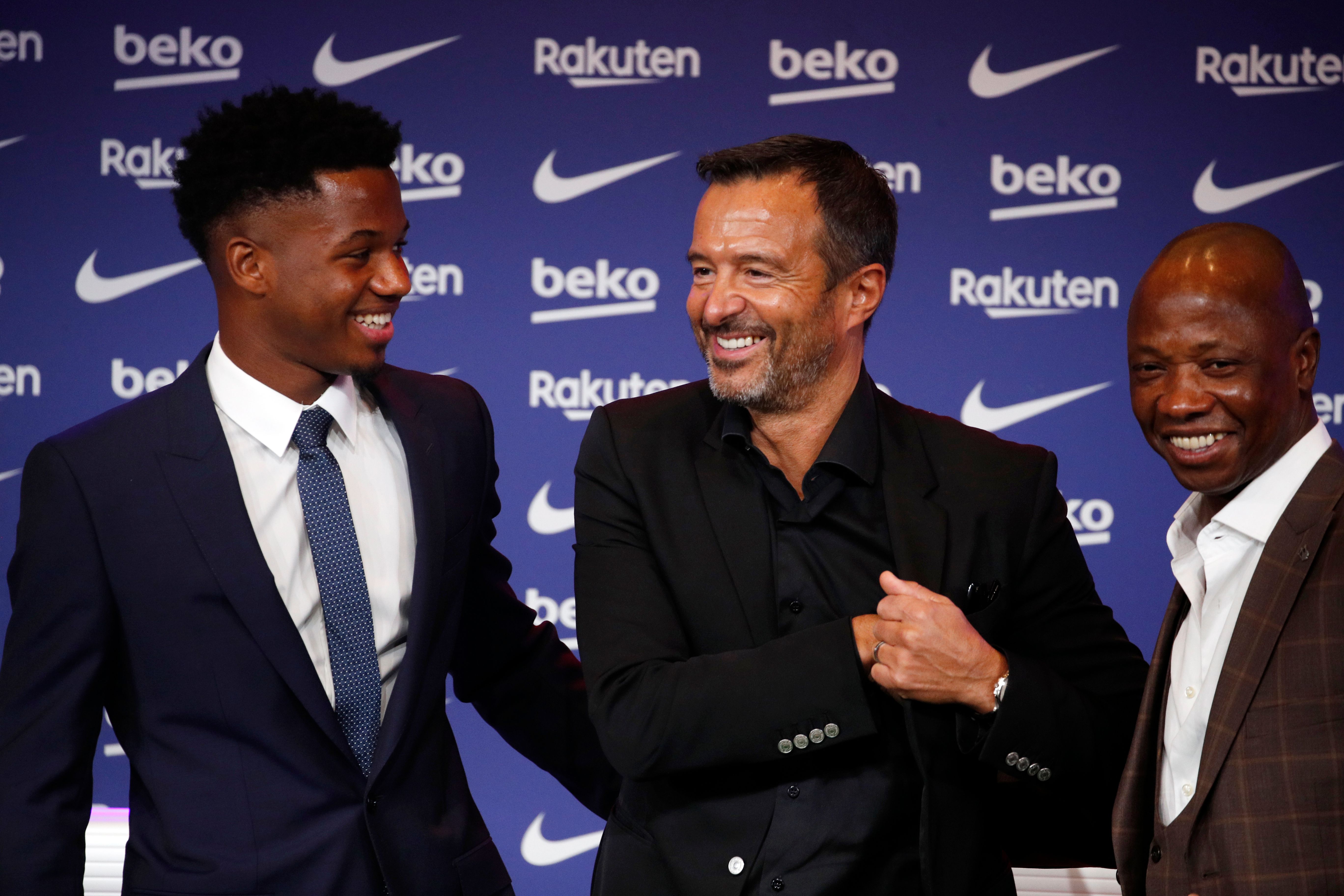 Ansu Fati and his agent gleam with pride as the Barcelona winger renews his contract with the Spanish club.