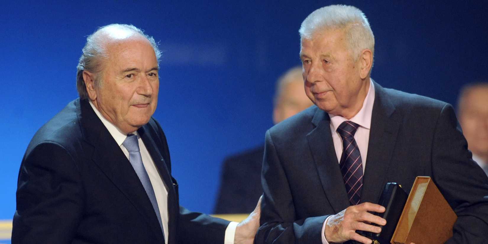 FIFA President Sepp Blatter (L) congratulates Czech legendary midfielder Josef Masopust on his 80th birthday