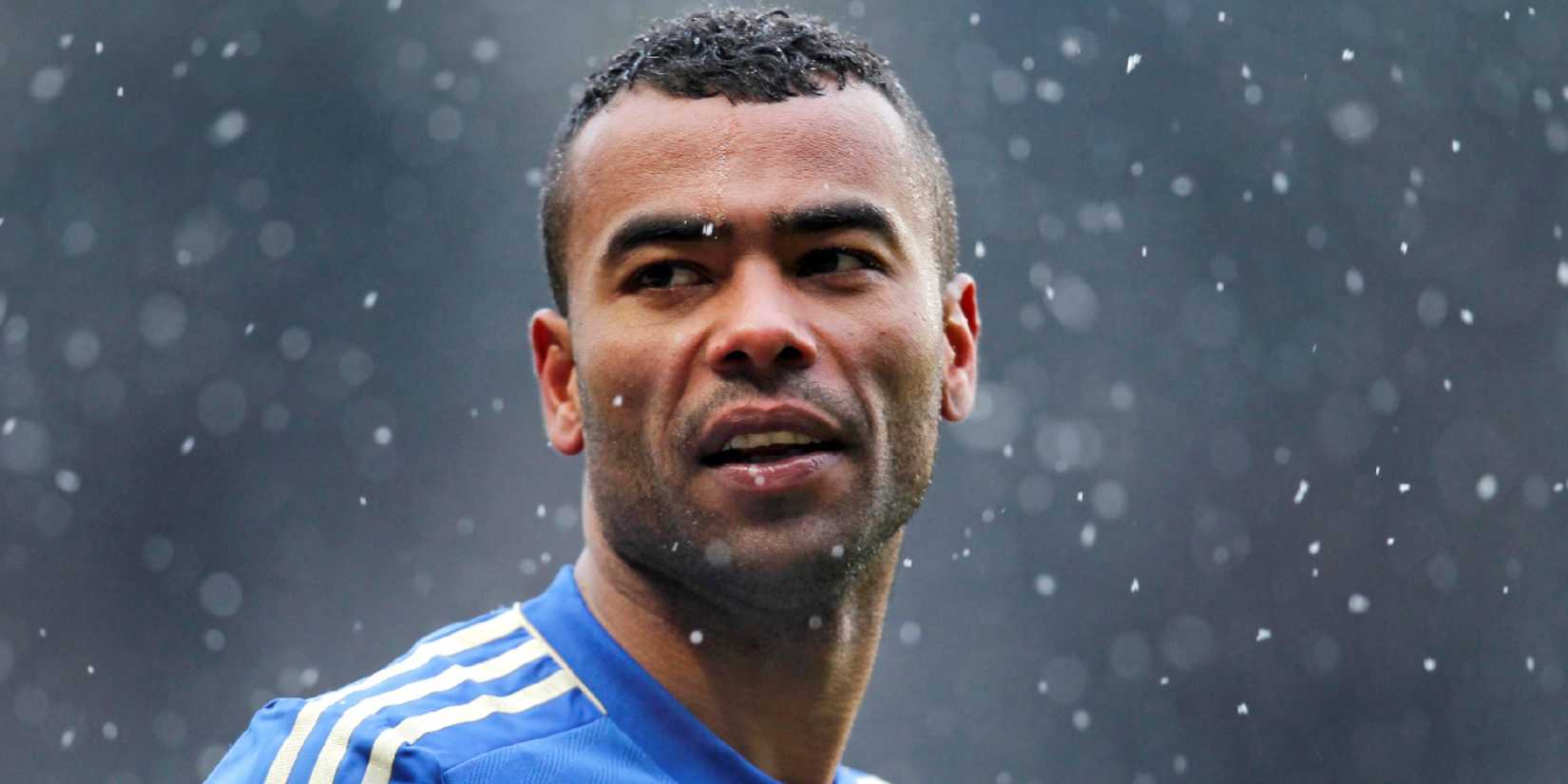 Ashley Cole looking on through the rain