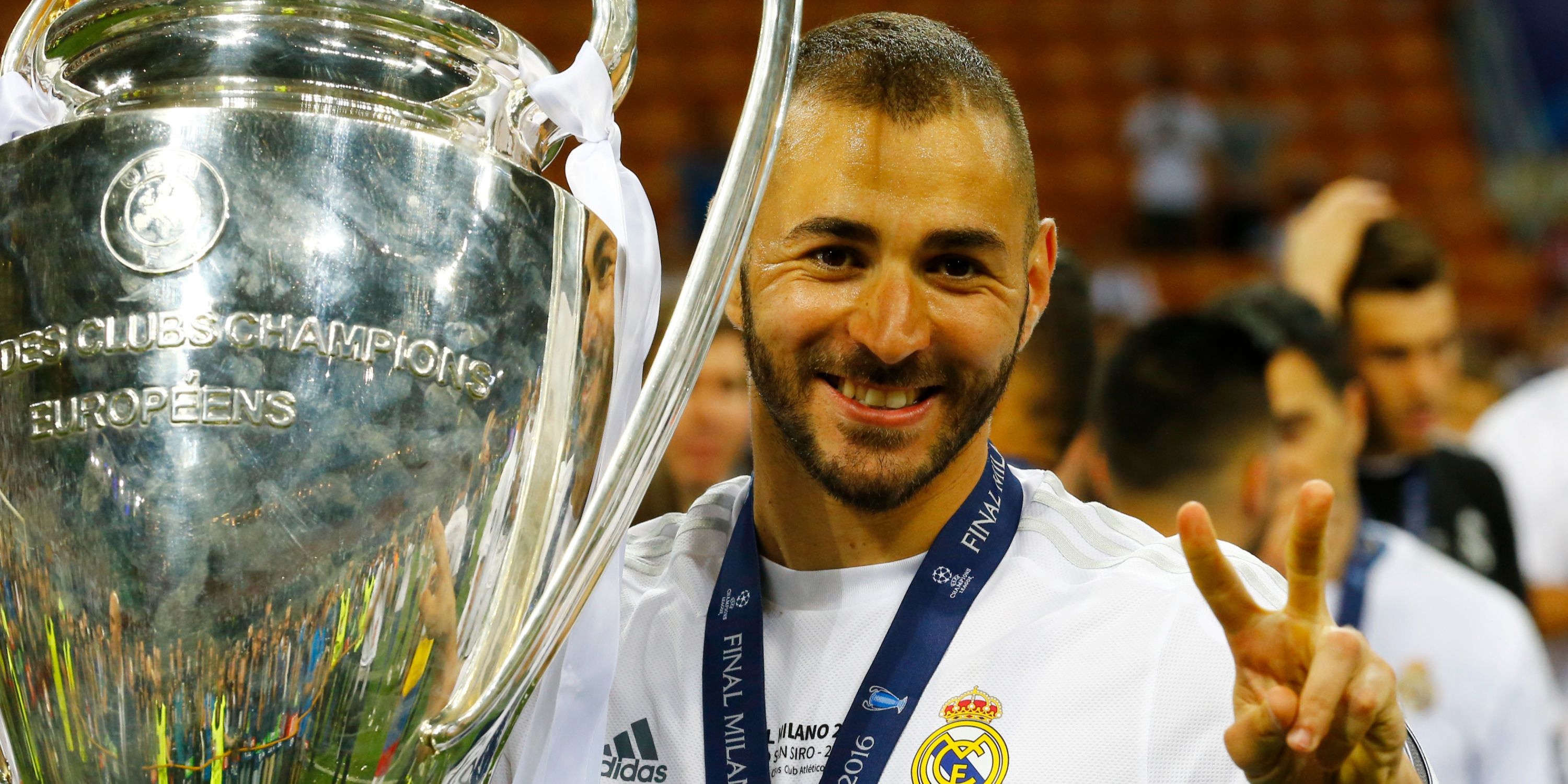 Karim Benzema with the Champions League trophy