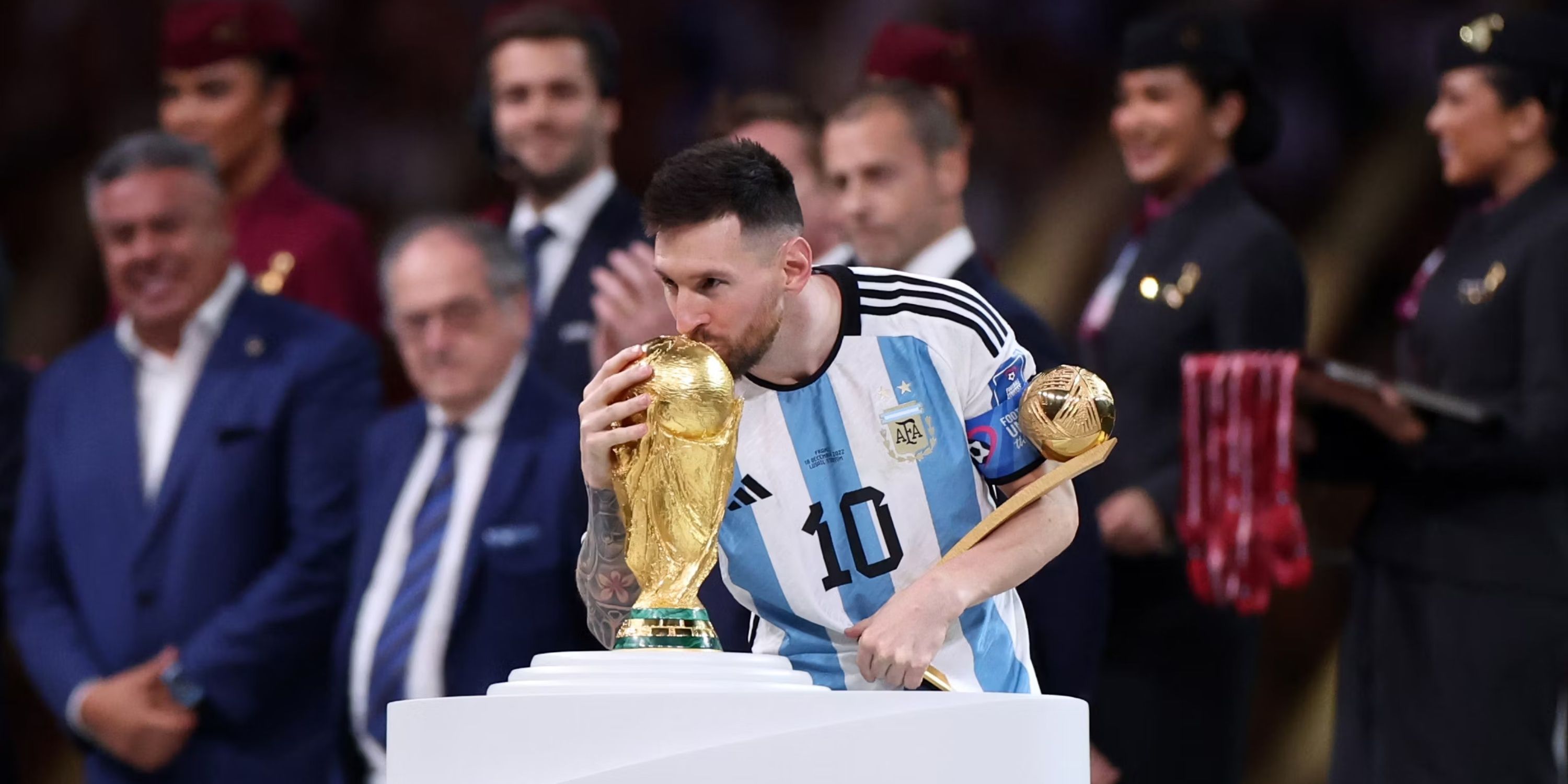 Lionel Messi kisses the coveted World Cup after leading his country to victory in Qatar.