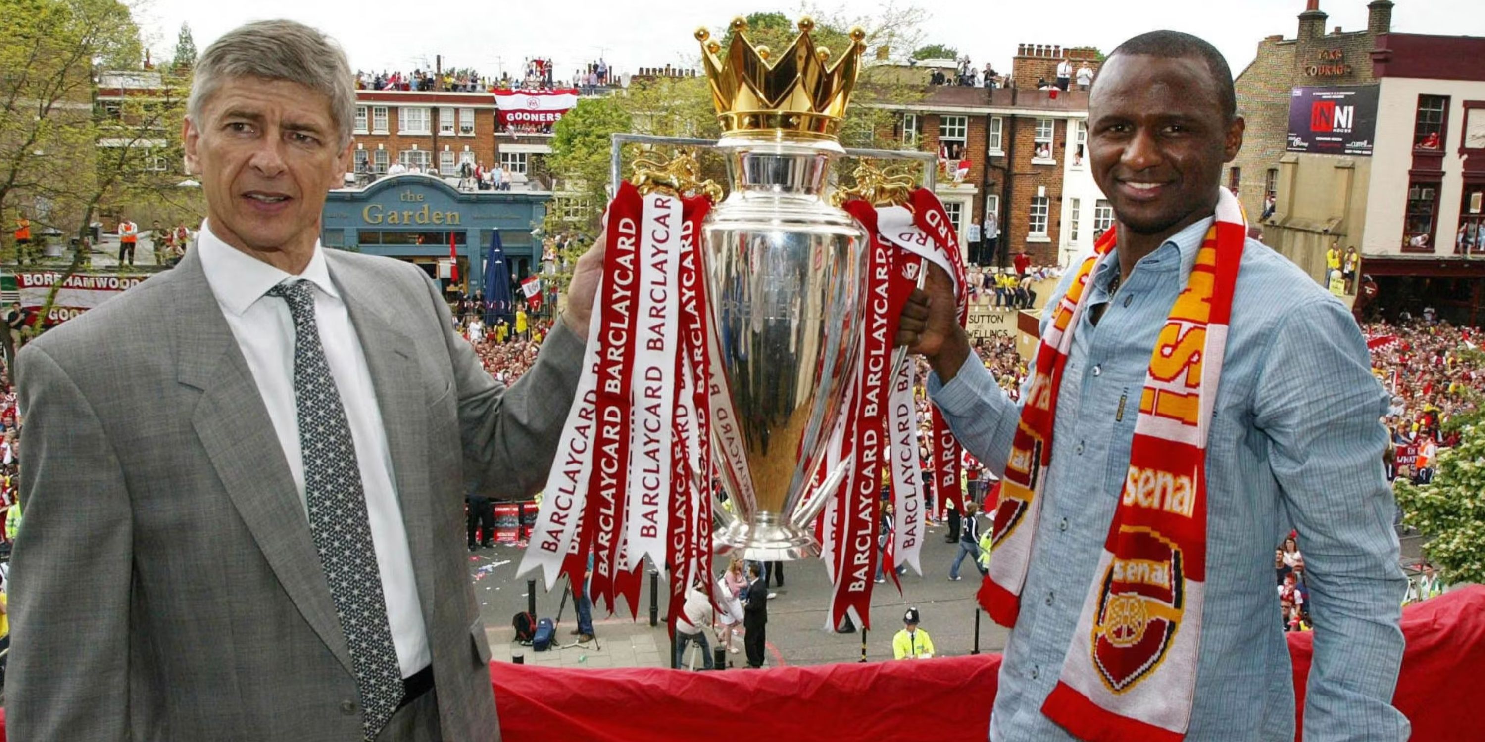 Arsenal's manager Arsene Wenger (L) of France and captain Patrick Vieira hold up the Barclaycard Premiership trophy 