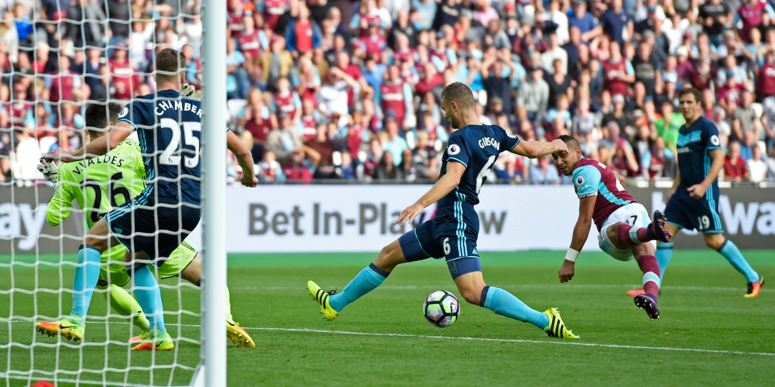 West Ham's Dimitri Payet hits a goal-bound shot through the legs of Middlesbrough's Ben Gibson. 