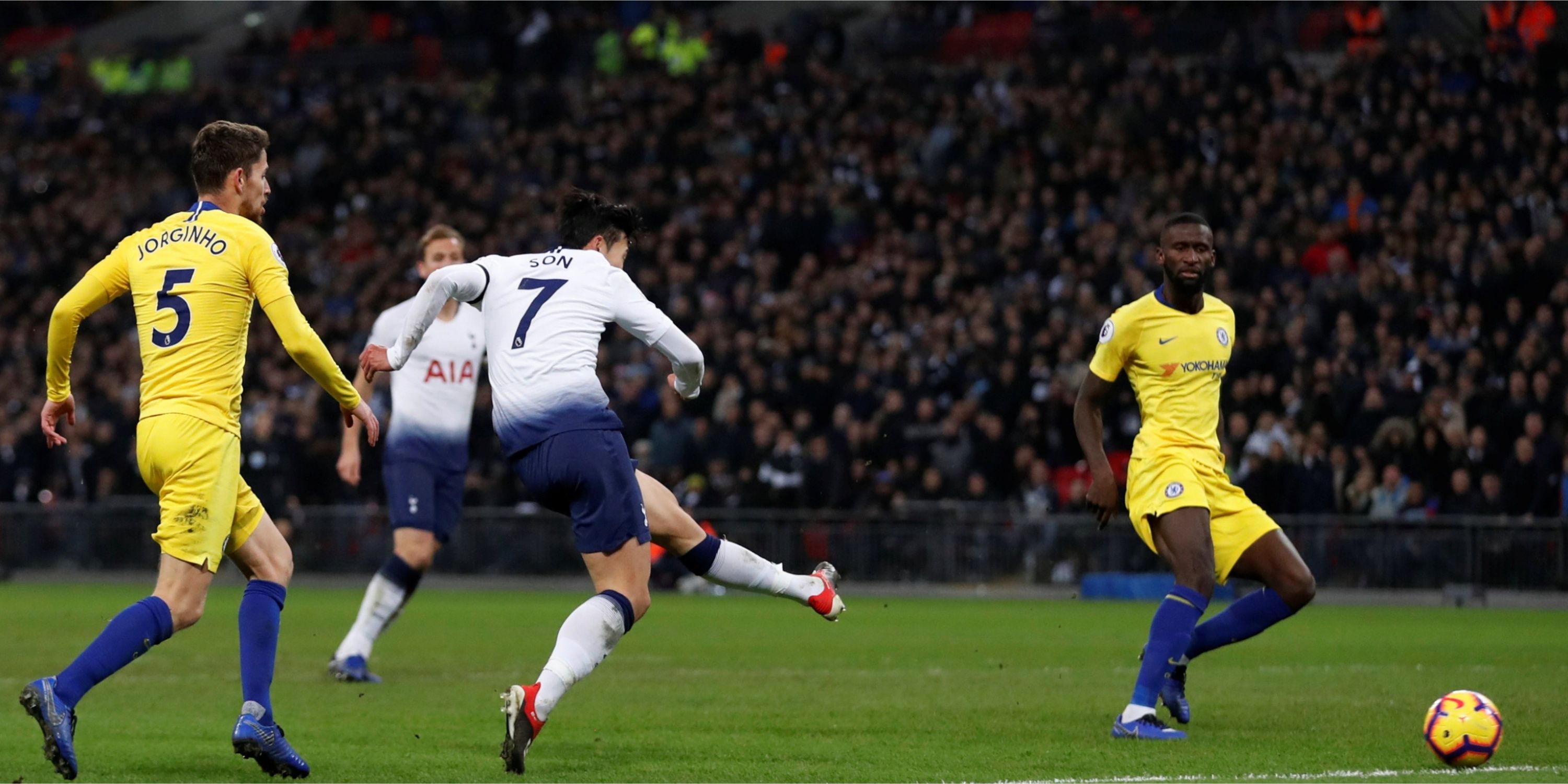 Tottenham's Heung-min Son takes the shot on against Chelsea. 