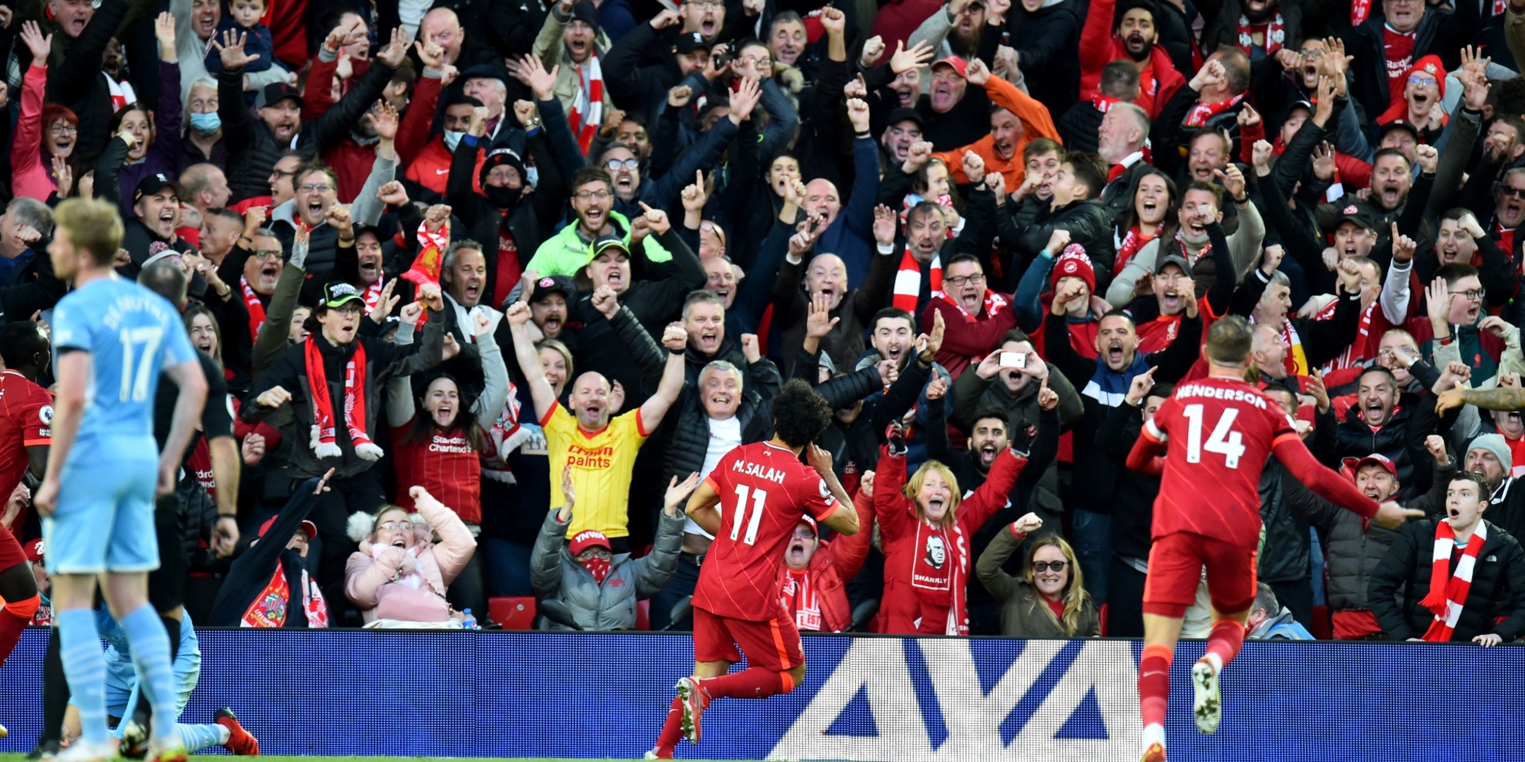 Mohamed Salah celebrates scoring for Liverpool in front of a jubilant crowd.