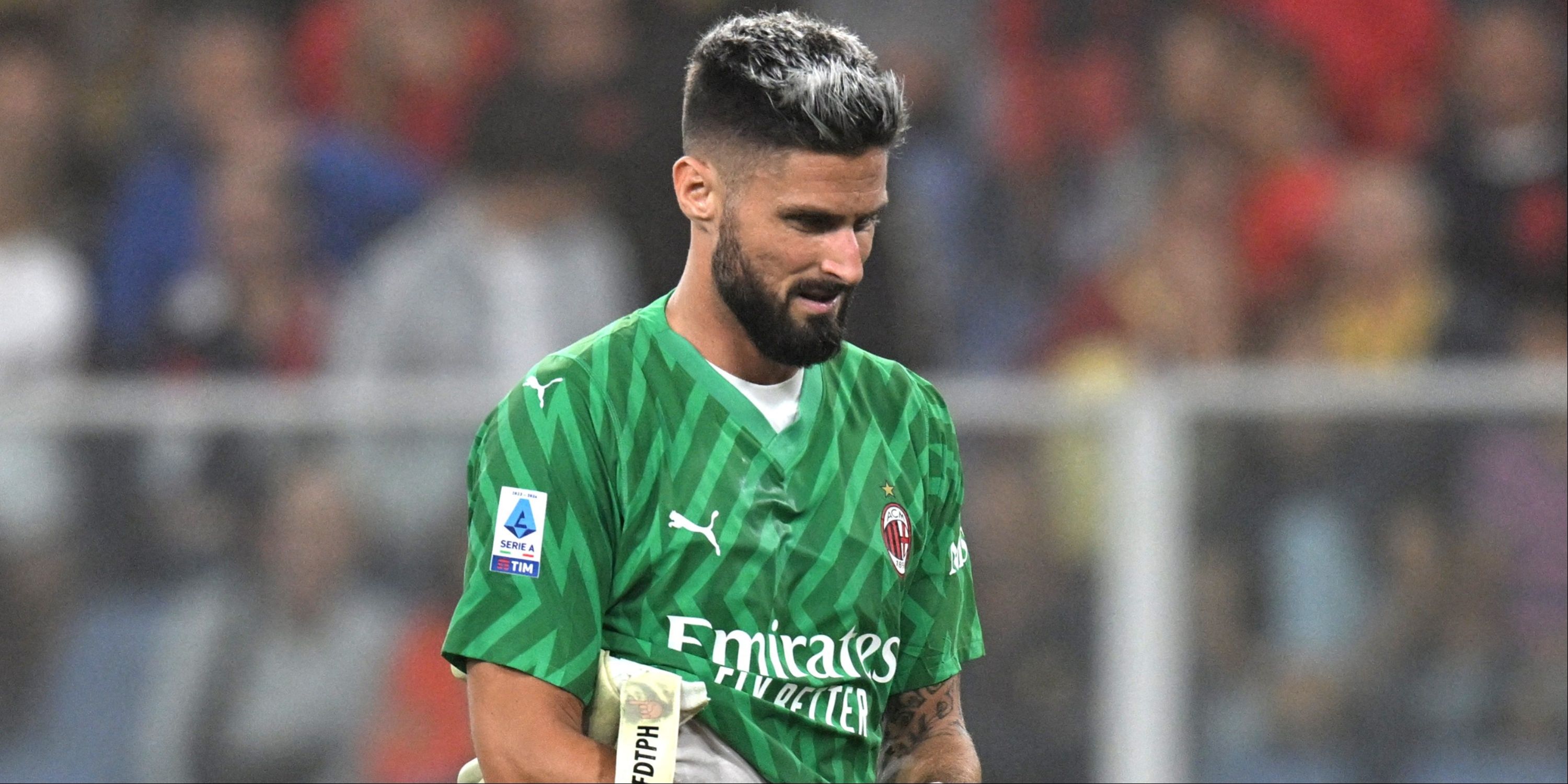 AC Milan's Olivier Giroud goes in goal after Mike Maignan is shown a red card