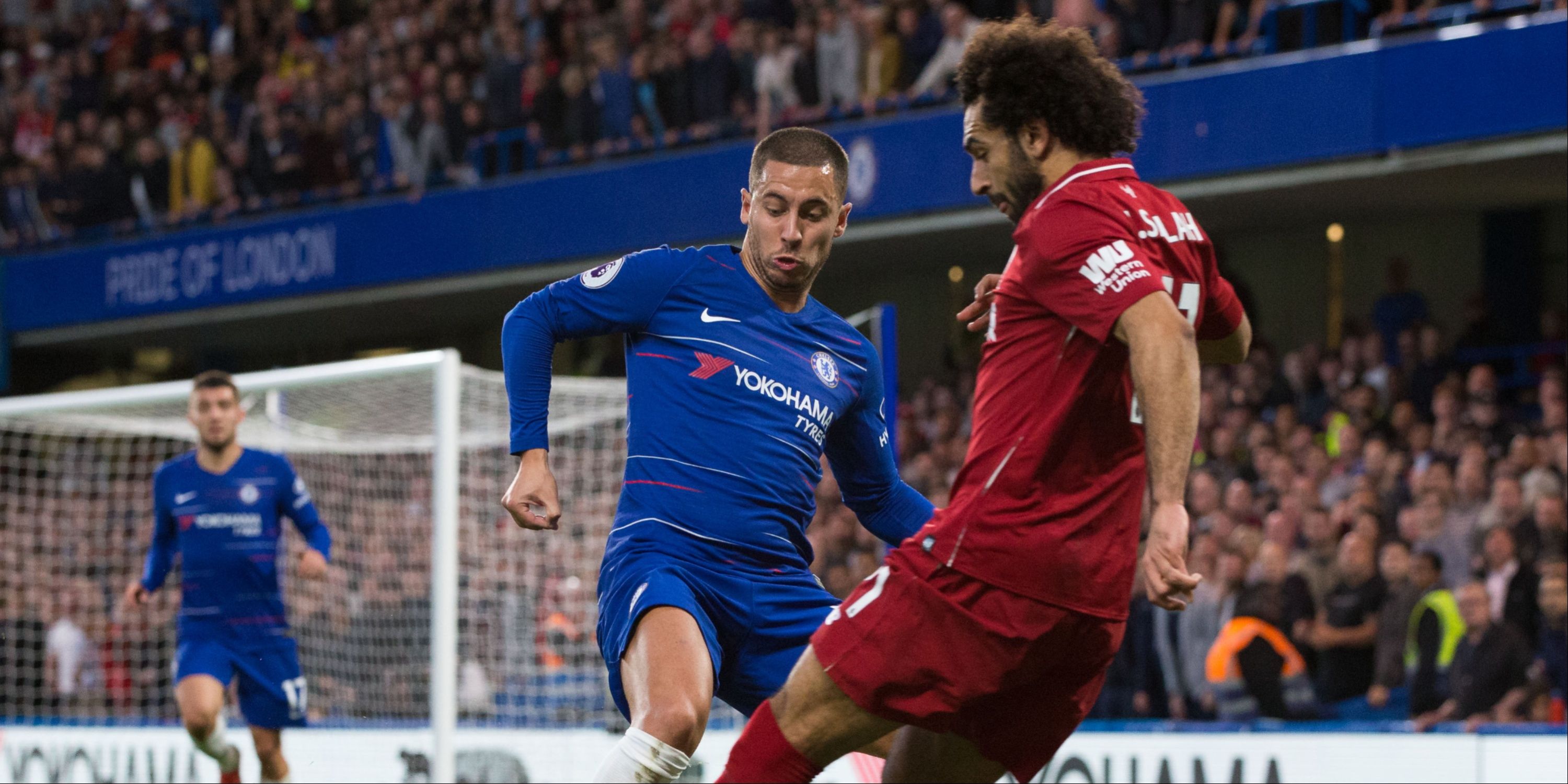 Eden Hazard of Chelsea vies for possession with Mohamed Salah of Liverpool