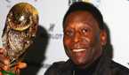 Pele holding the FIFA World Cup.