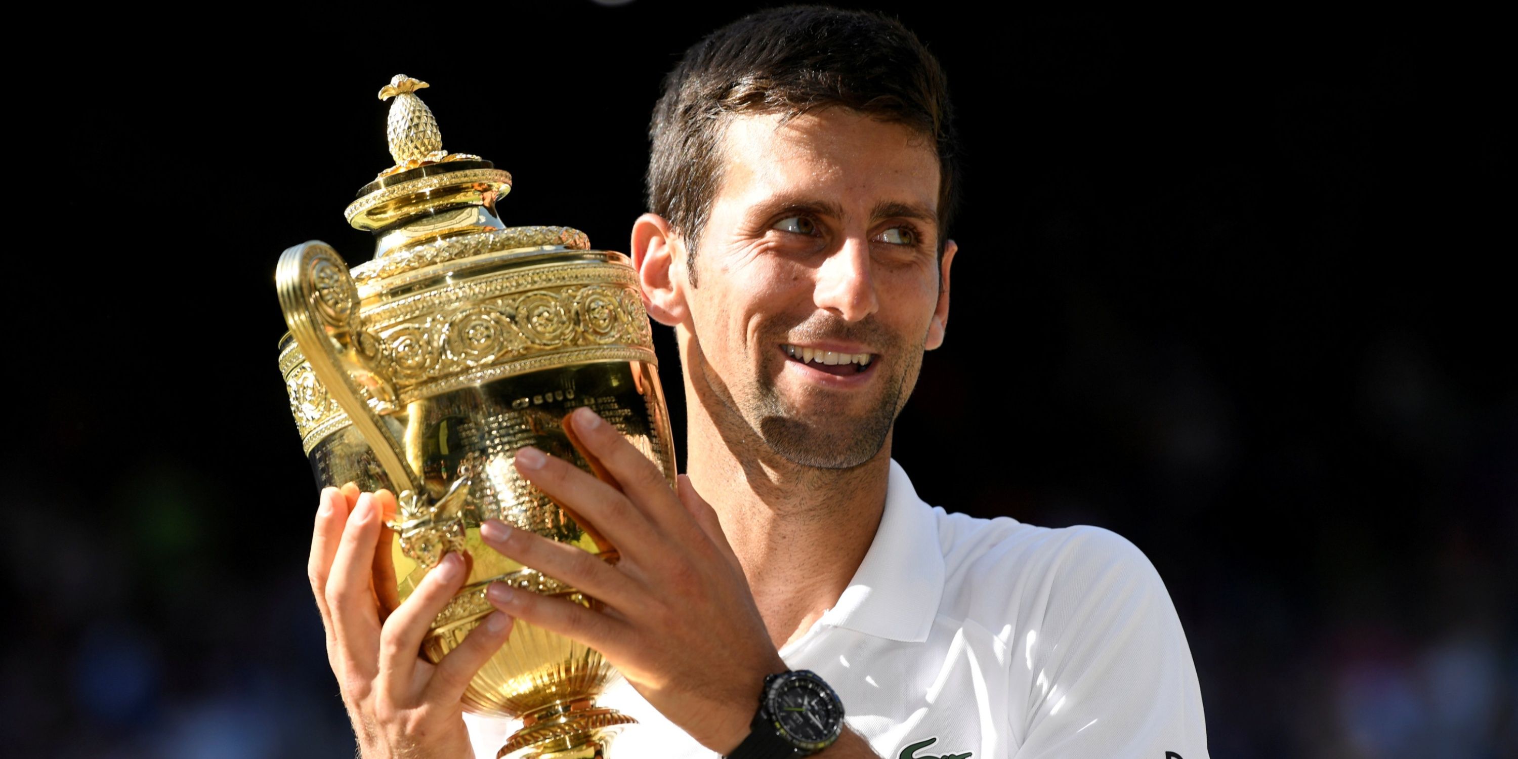 Serbia's Novak Djokovic celebrates with the trophy