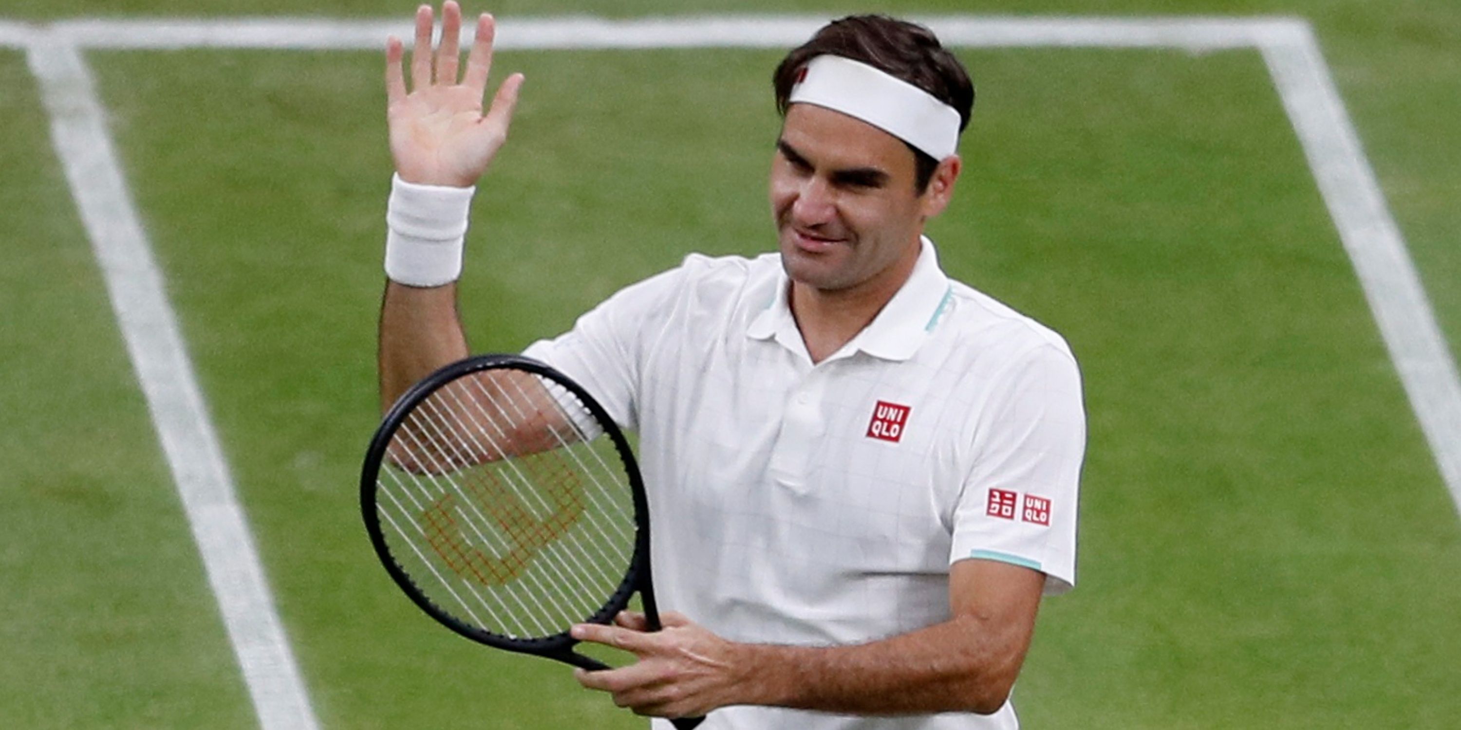 Roger Federer waves to the crowd.