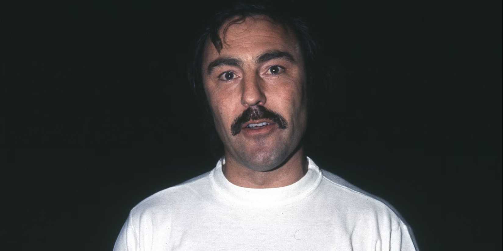 Jimmy Greaves in a white shirt looking into the camera