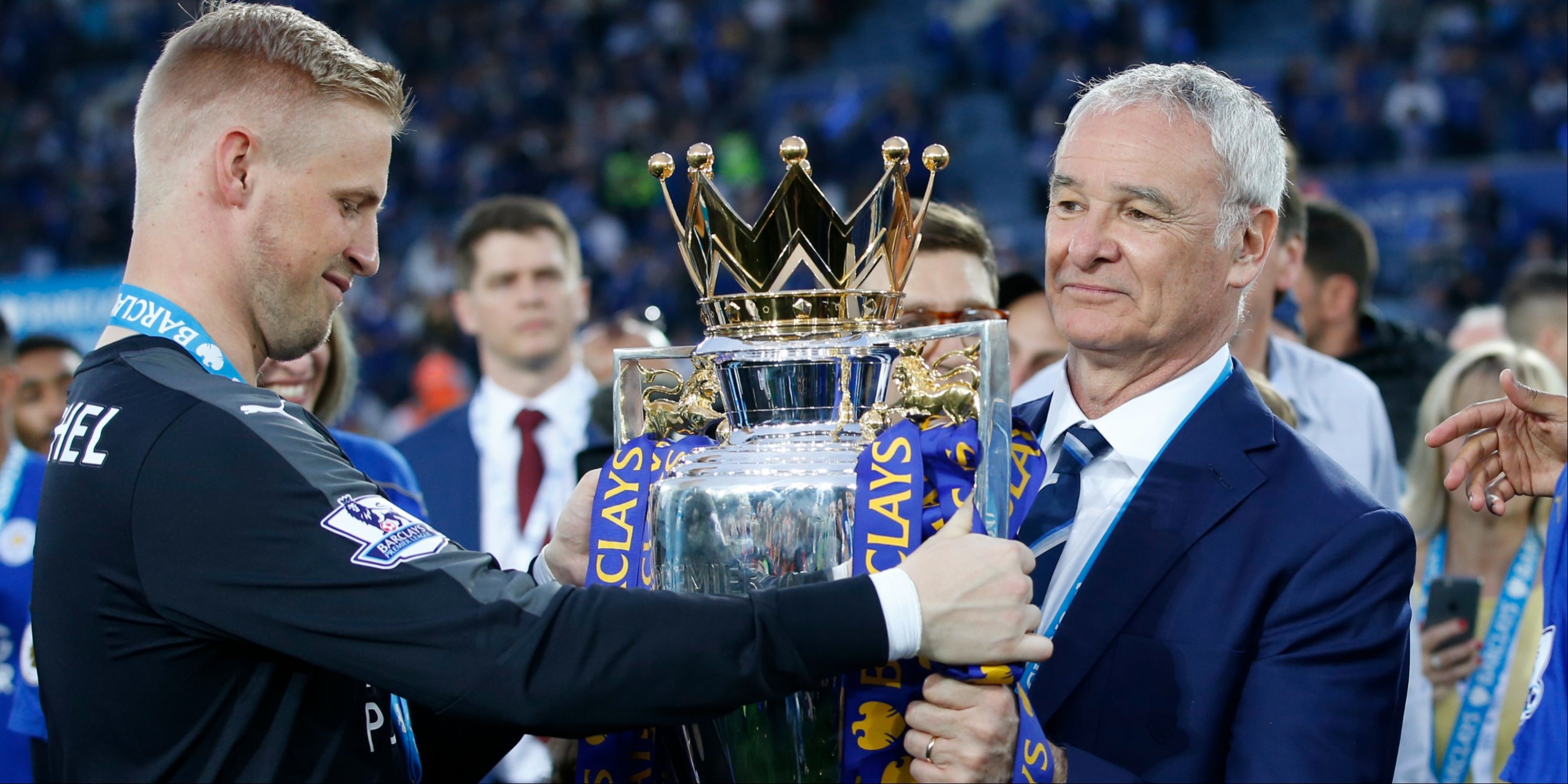 Leicester City manager Claudio Ranieri lifts the trophy with Kasper Schmeichel