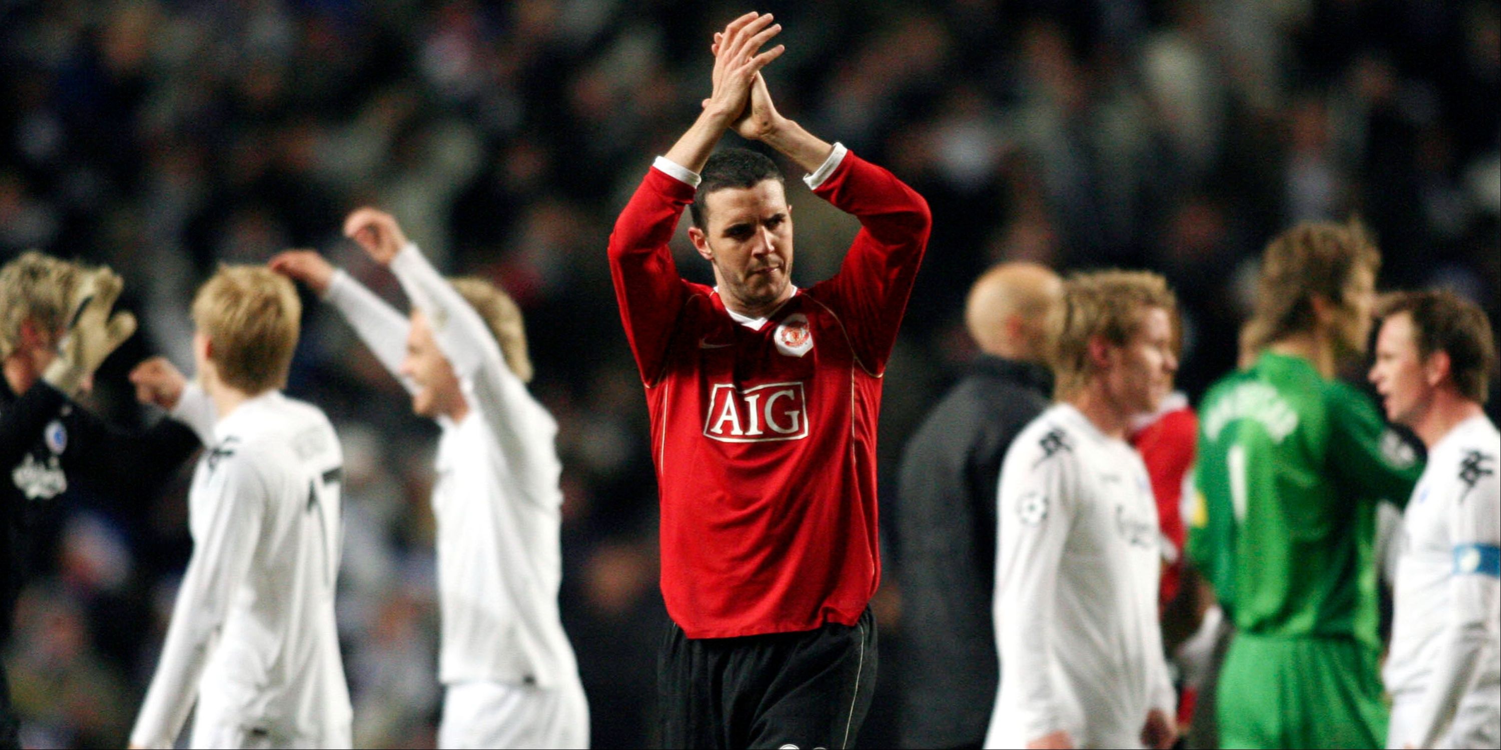 Manchester United's John O'Shea applauds the travelling supporters after the defeat