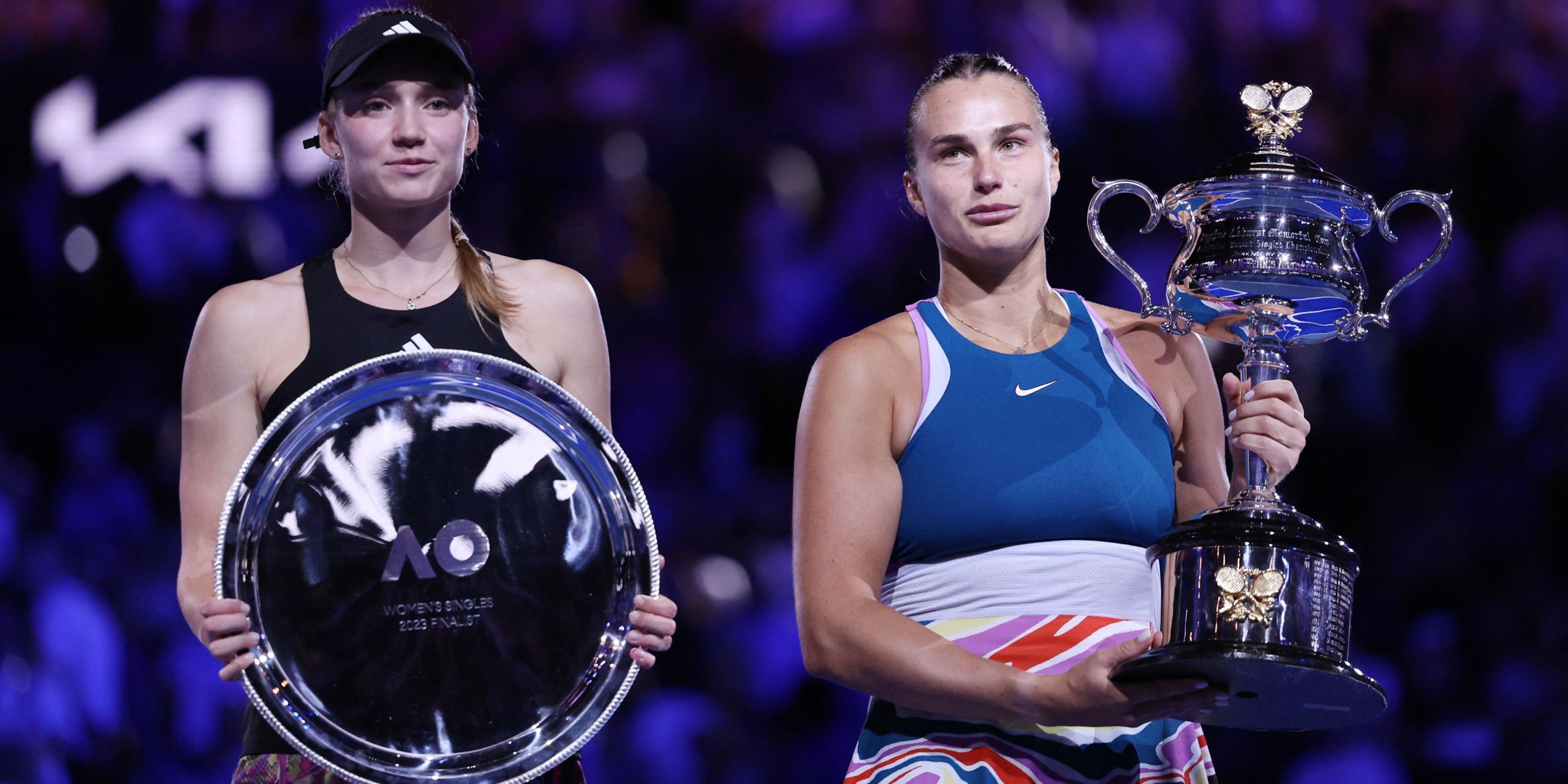 Belarus’ Aryna Sabalenka celebrates with the trophy after winning her final match as Kazakhstan’s Elena Rybakina is pictured with the runners-up trophy.