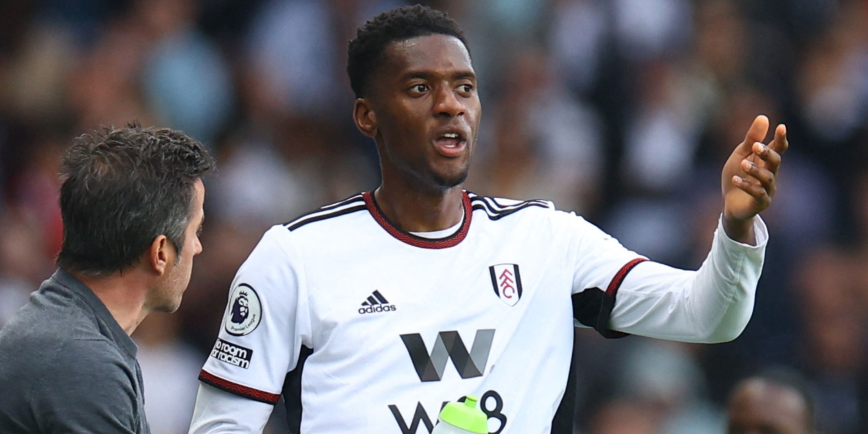 Fulham central defender Tosin Adarabioyo talking with boss Marco Silva