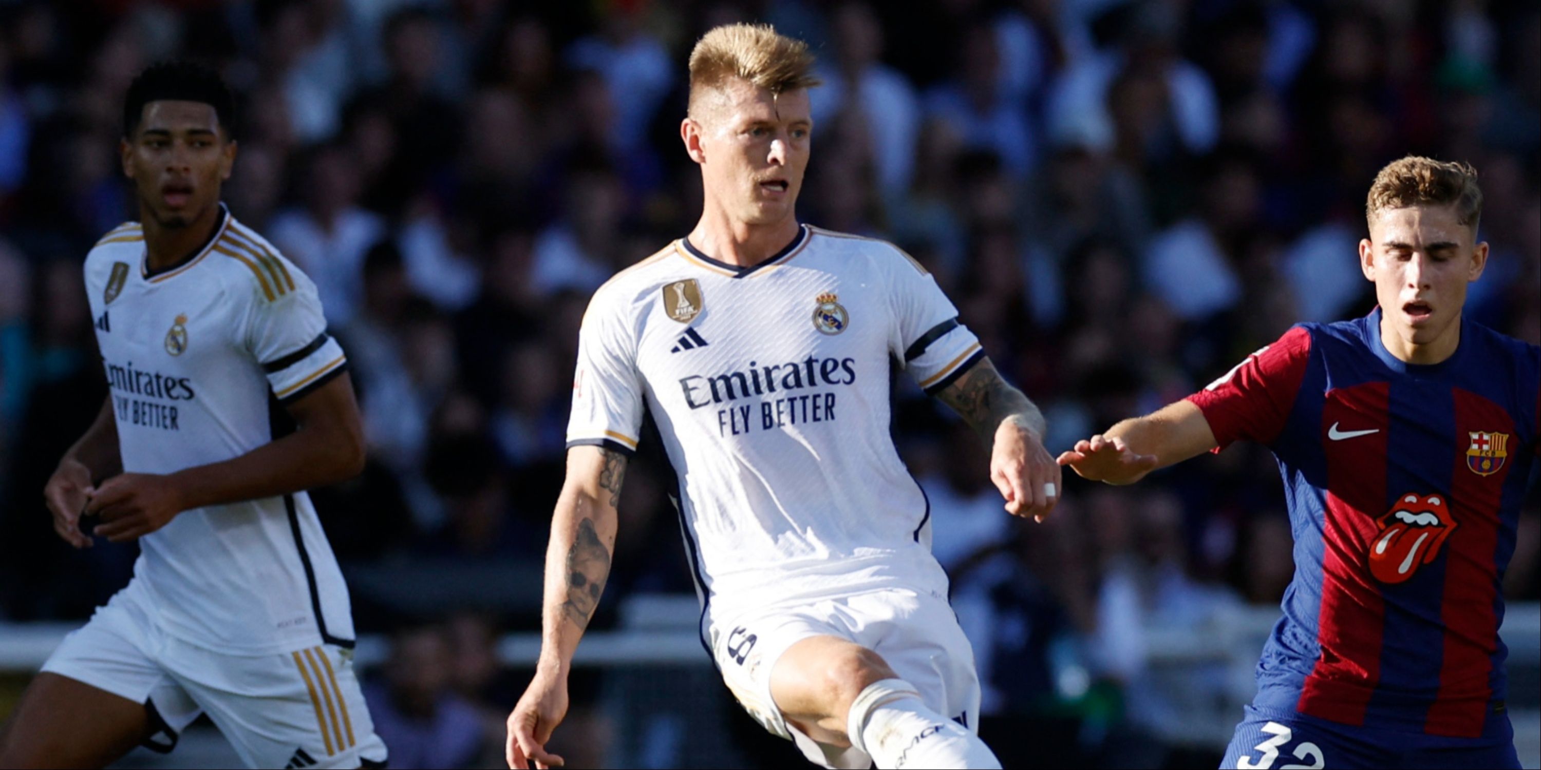 Real Madrid's Toni Kroos in action with FC Barcelona's Fermin Lopez
