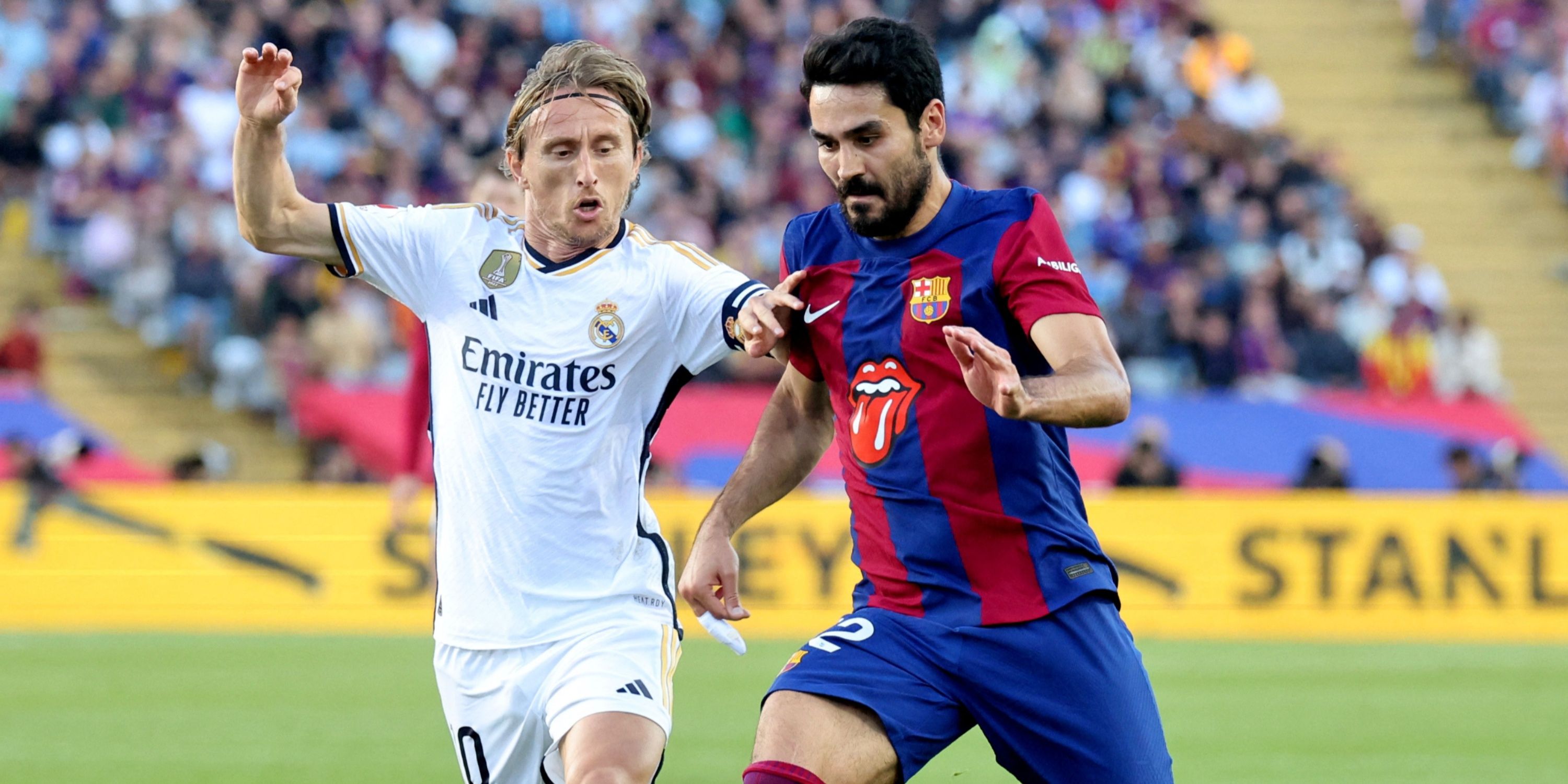 Luka Modric and Ilkay Gundogan fight for the ball in El Clasico