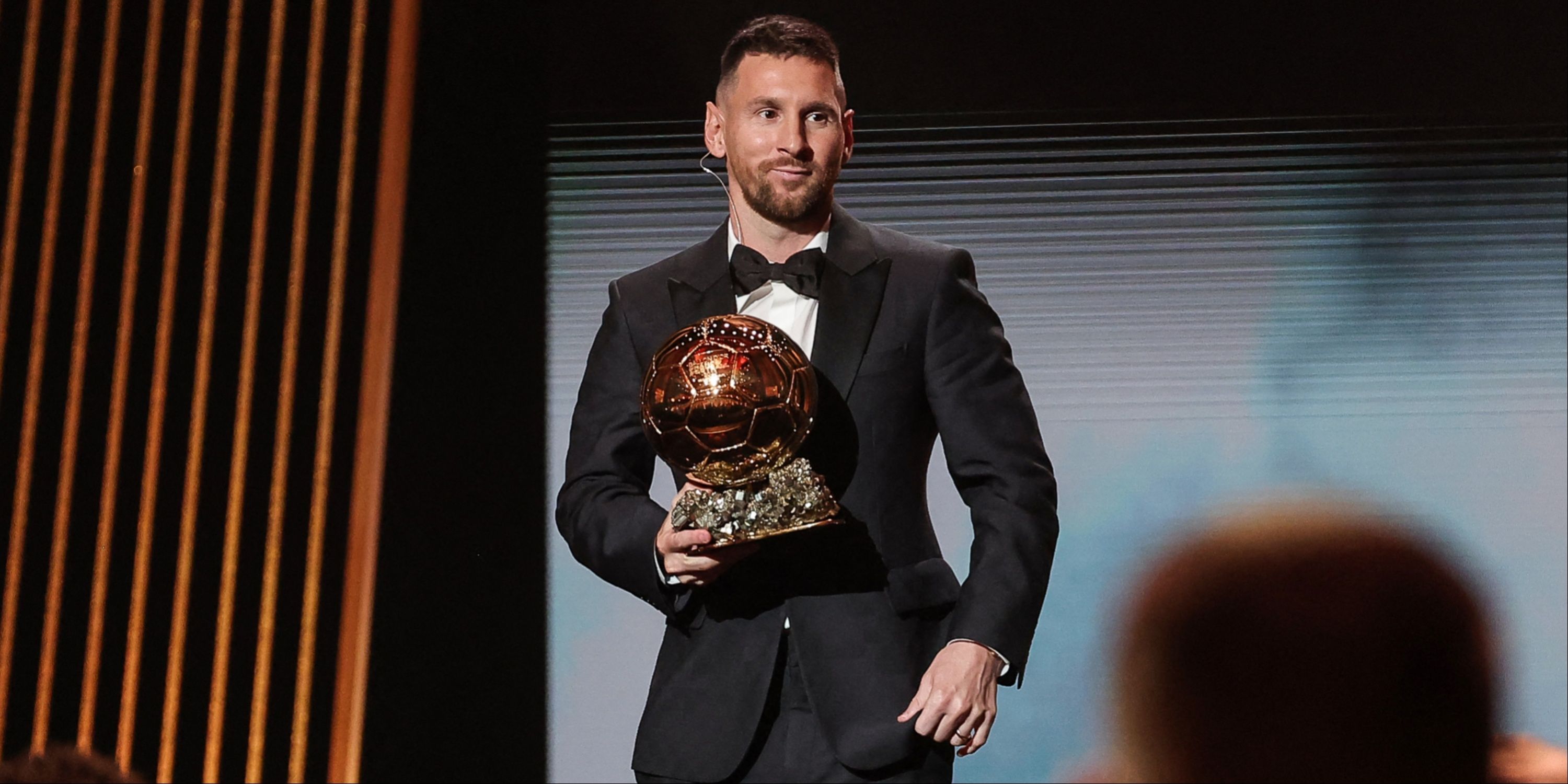 Inter Miami CF's Argentine forward Lionel Messi holds his trophy on stage as he receives his 8th Ballon d'Or award