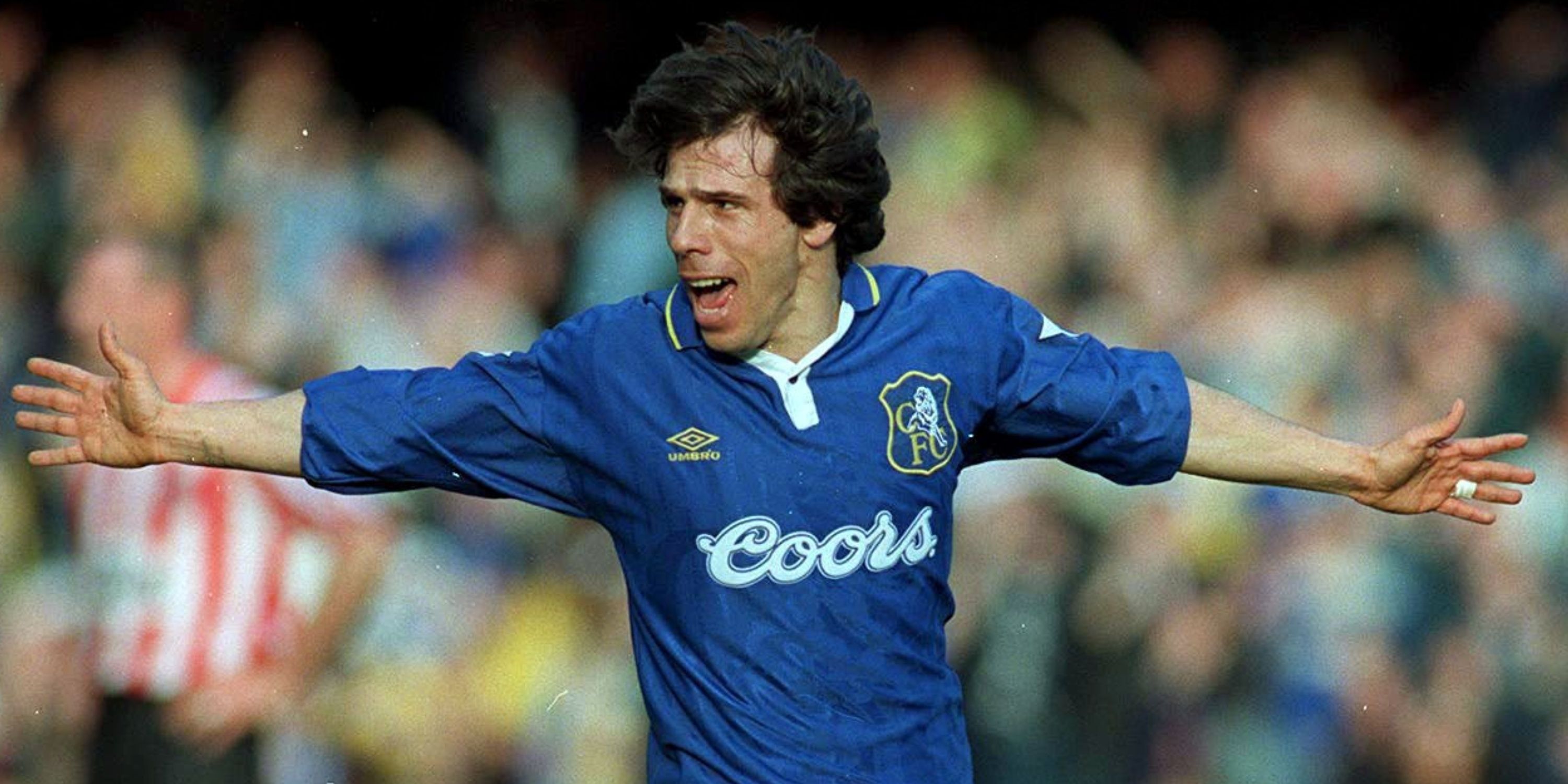Gianfranco Zola celebrates with his arms outstretched after scoring for Chelsea.