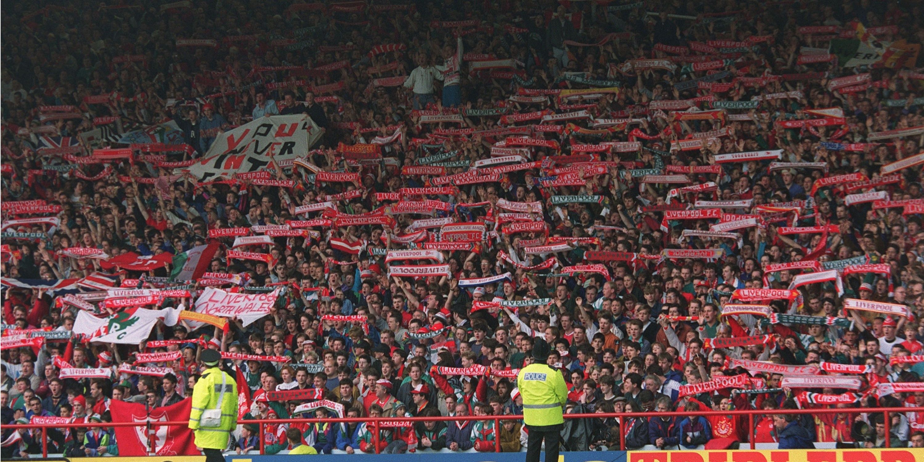 Liverpool supporters in unison on the Kop