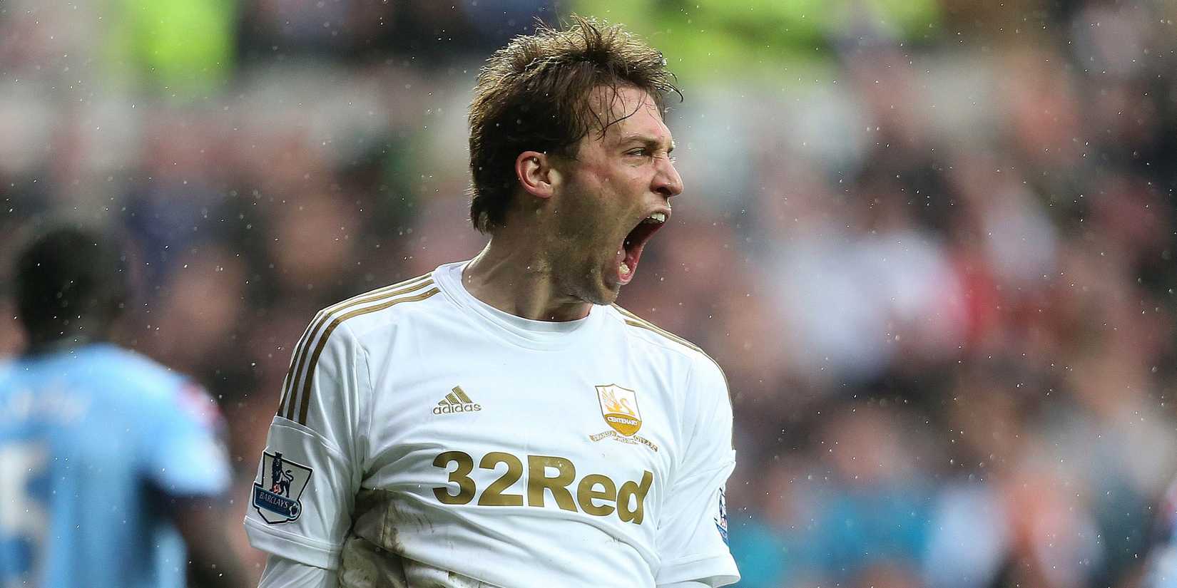 Swansea City's Michu roars with delight after scoring. 