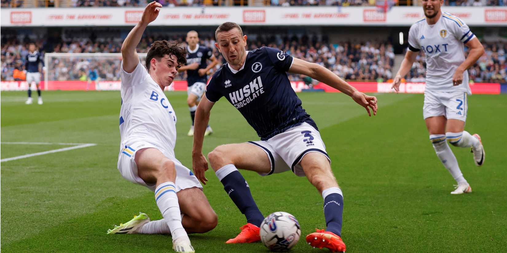 Millwall's Murray Wallace in action with Leeds United's Archie Gray