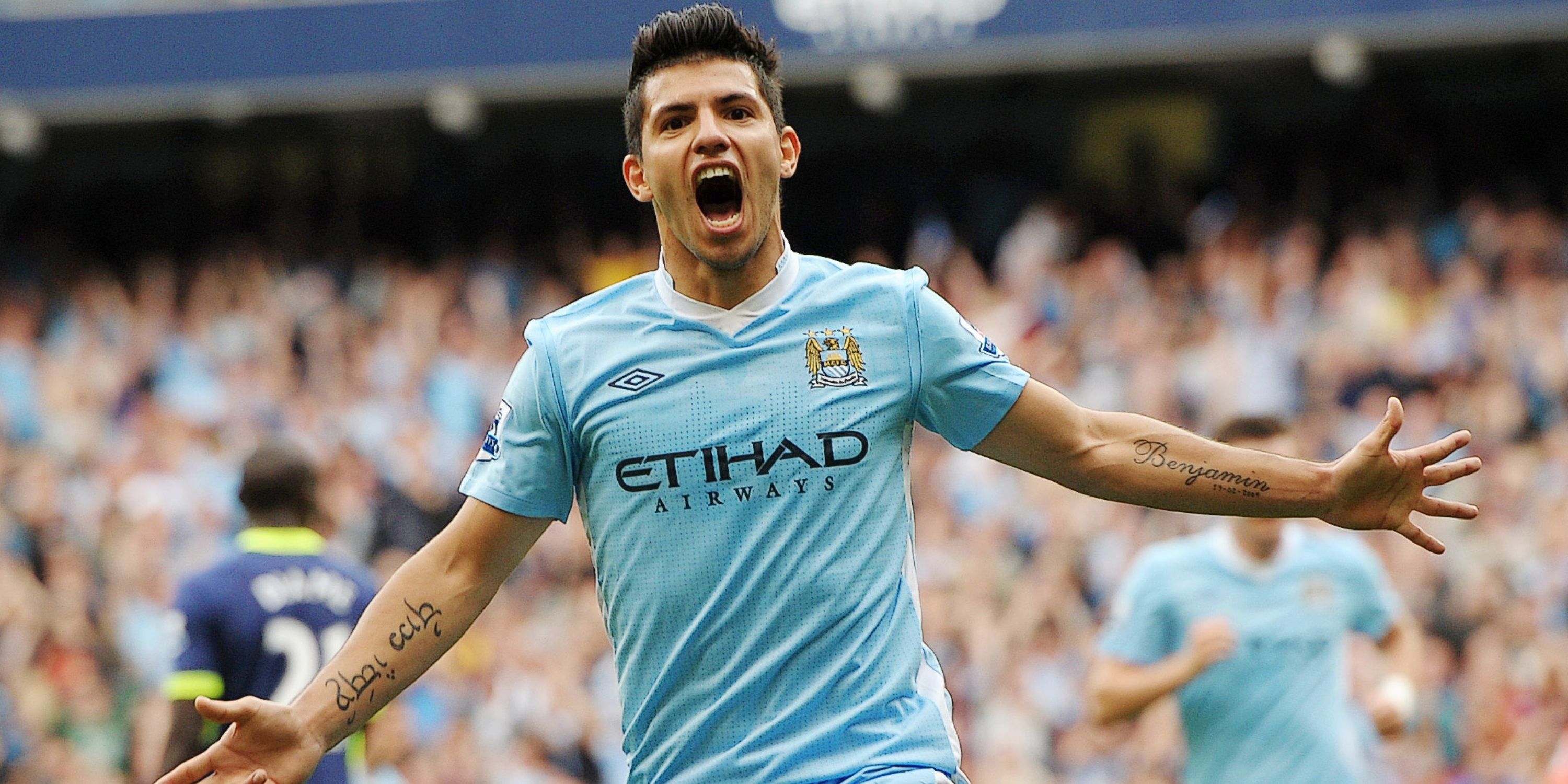 Sergio Aguero roars with delight after scoring for Manchester City.