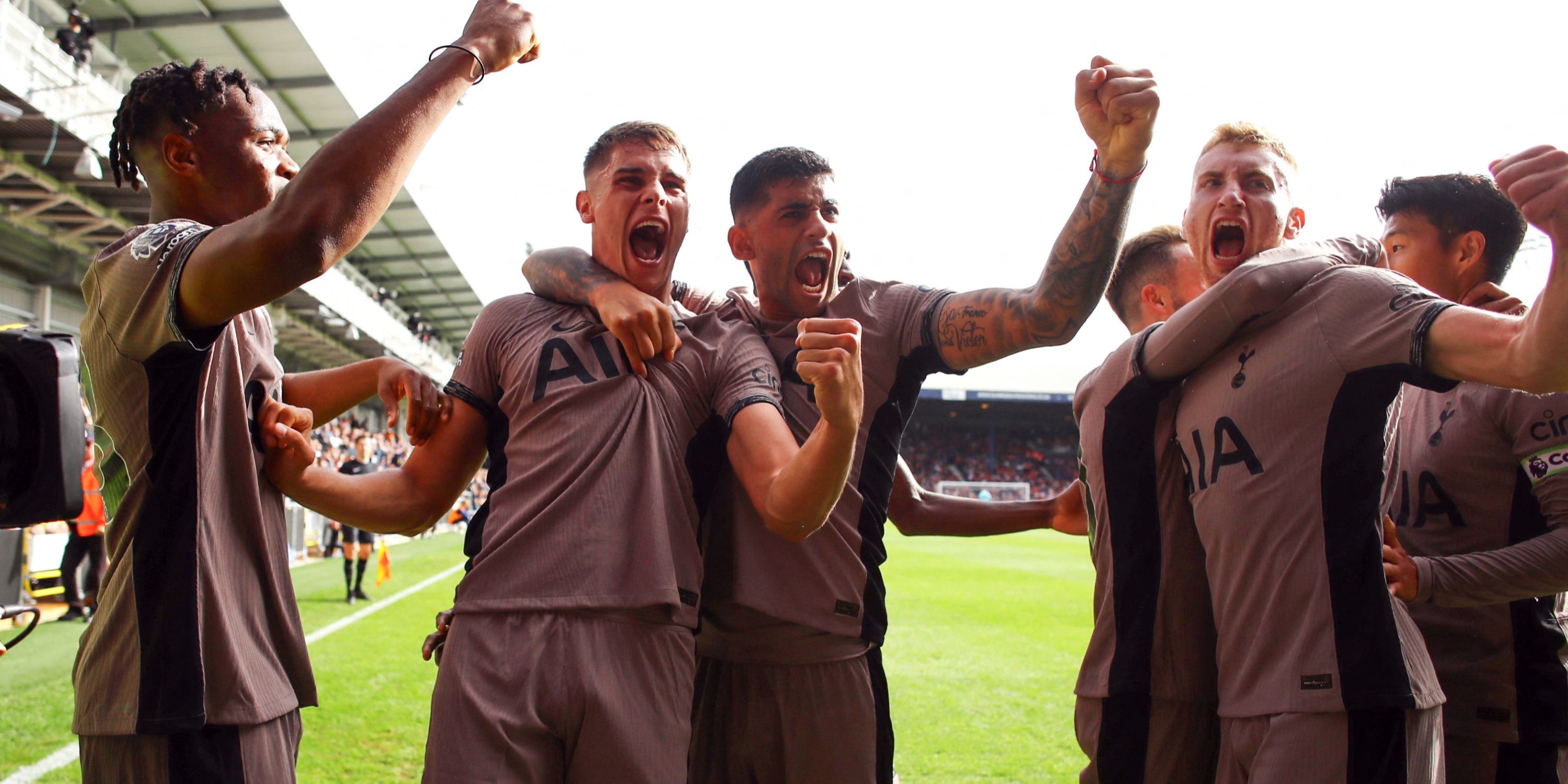 Tottenham Hotspur's Micky van de Ven celebrates scoring with Cristian Romero and teammates
