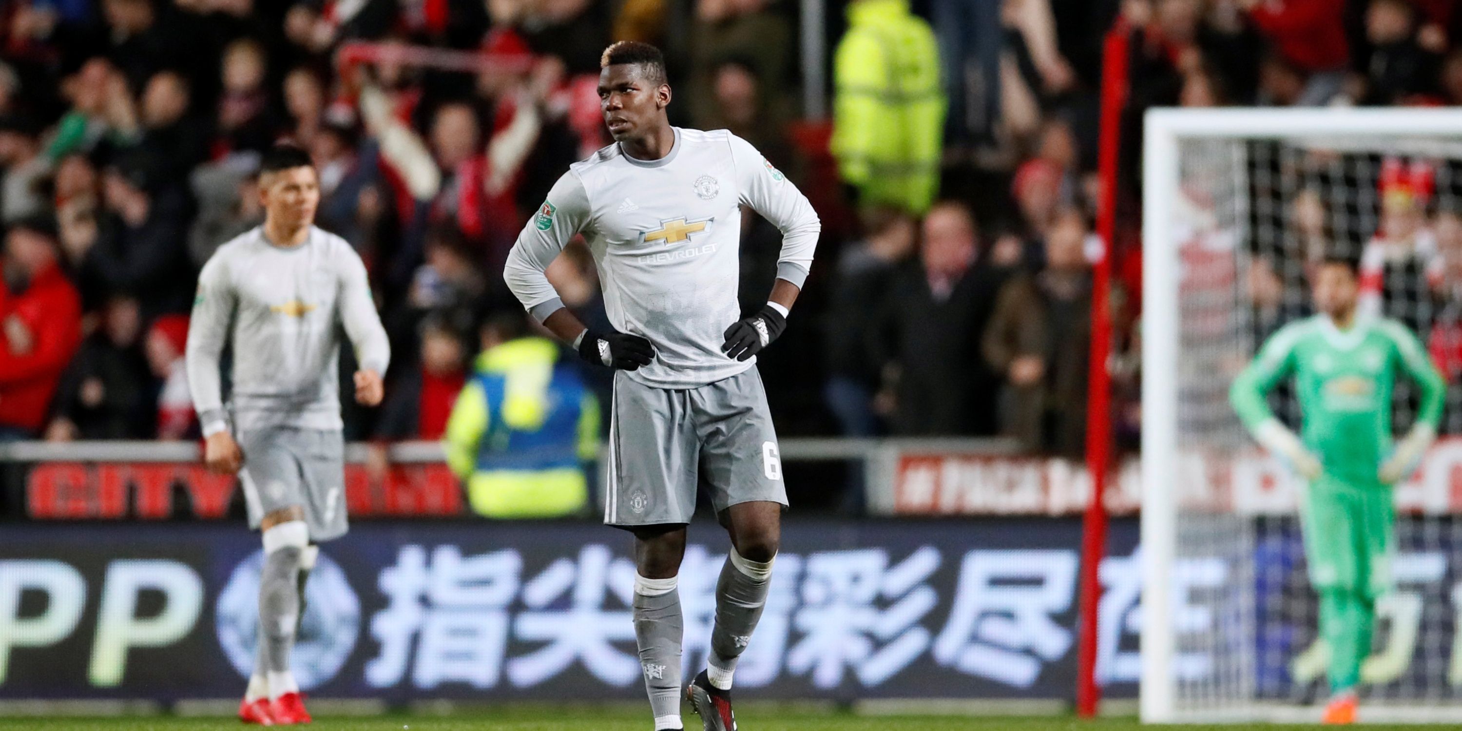 Manchester United's Paul Pogba places his hands on his hips after his side concede to Bristol City.