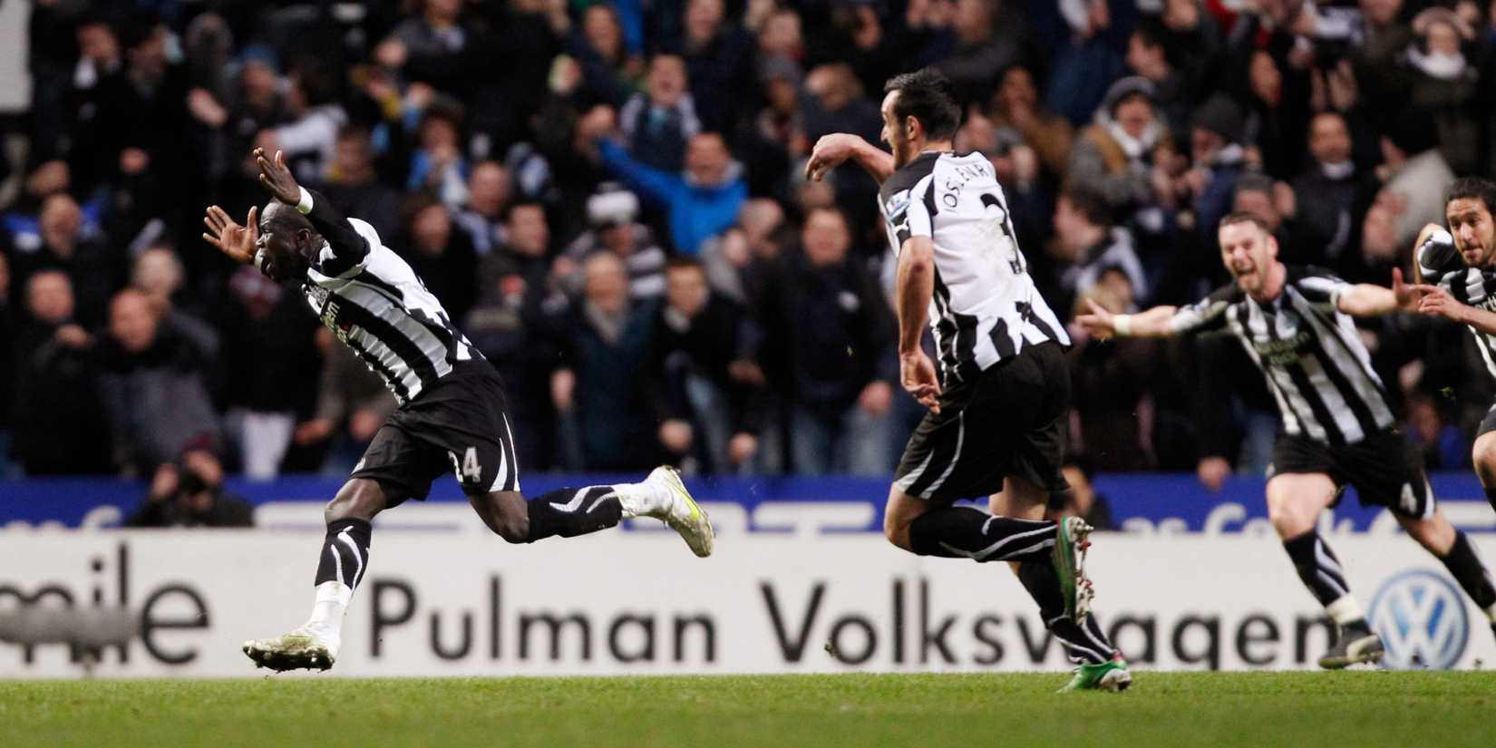 Newcastle United's Cheick Tiote races away in celebration in the wake of his teammates. 