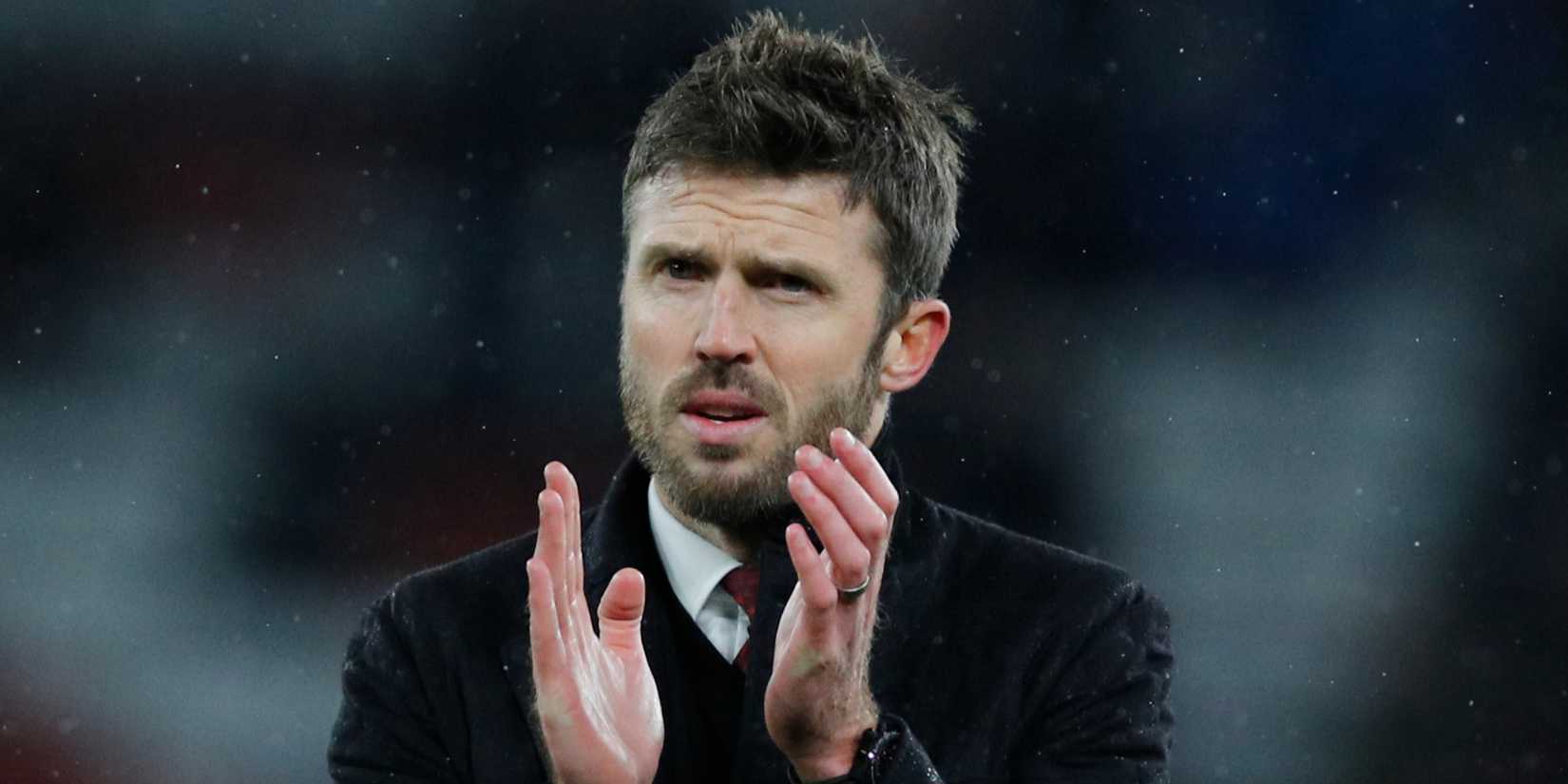 Manchester United interim manager Michael Carrick applauds fans