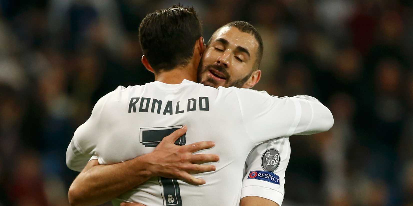 Real Madrid teammates Karim Benzema and Cristiano Ronaldo embrace after a goal.