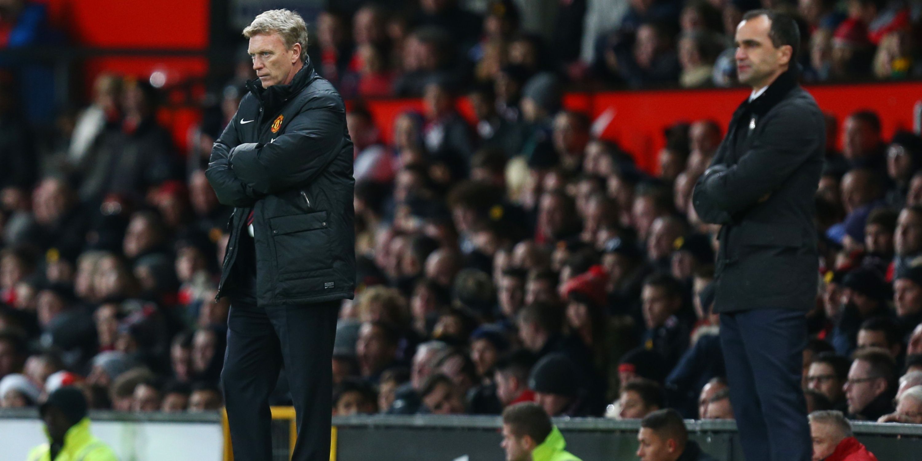 Manchester United manager David Moyes stands on the touchline alongside Everton boss Roberto Martinez. 