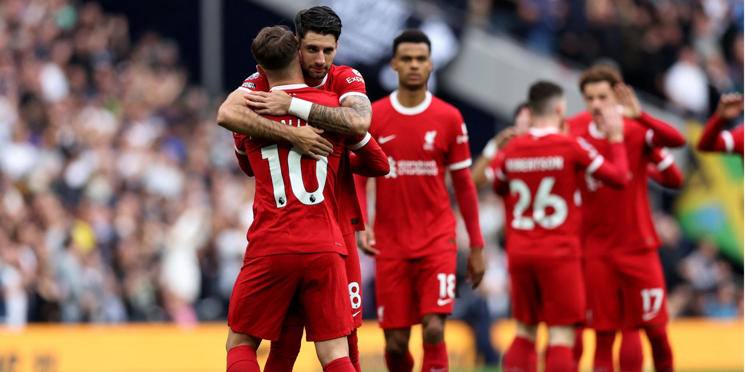 Dominik Szoboszlai embraces Liverpool teammate Alexis Mac Allister. 